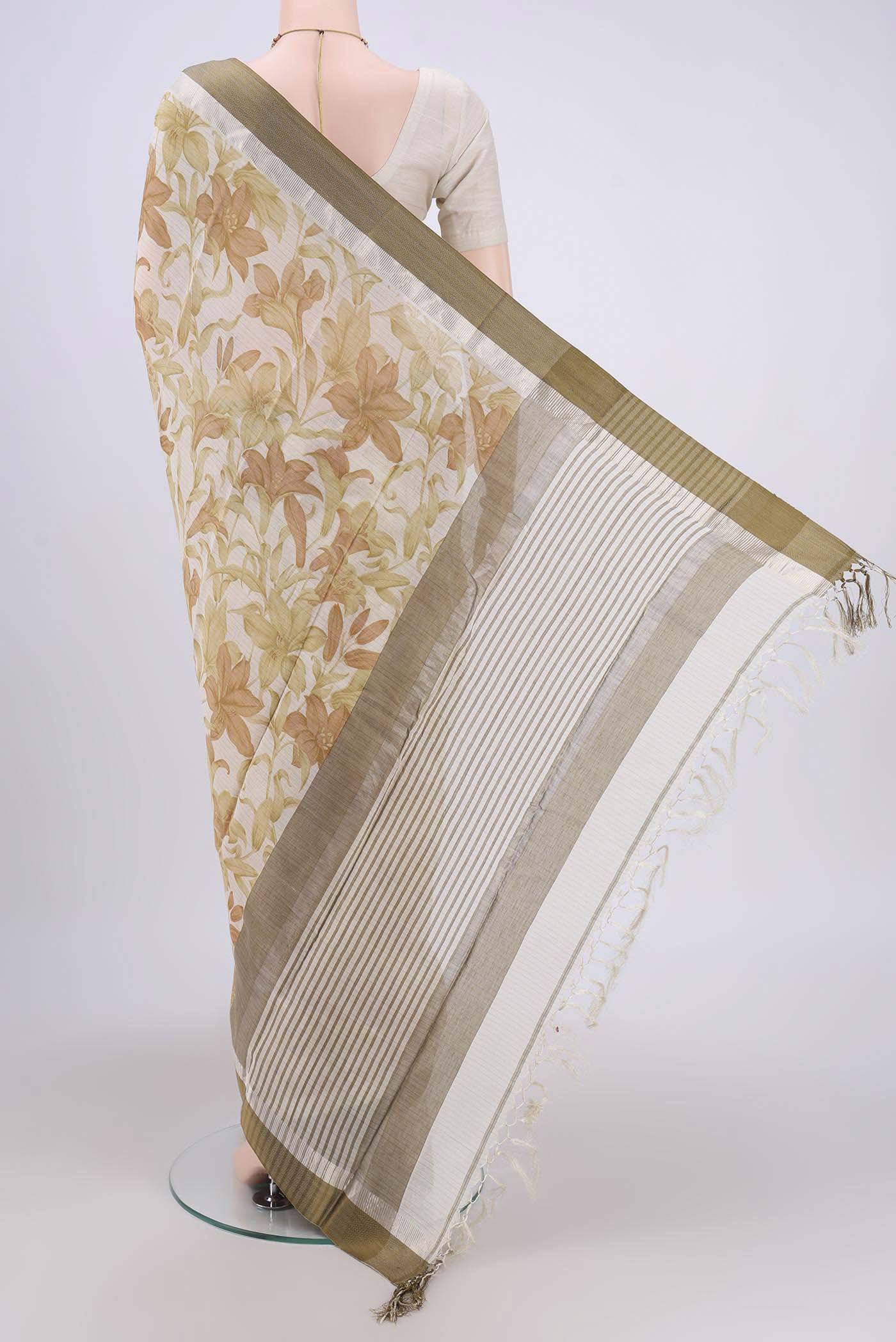 Flat view of Off White Tussar Saree with Floral Print on the body and Plain Border. 