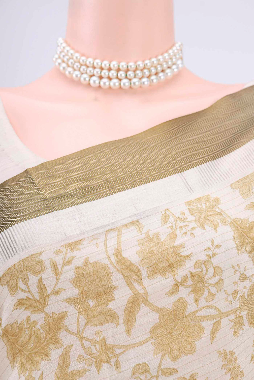 Border image of Cream Tussar Saree with Floral Print on the body and Thread Border. 