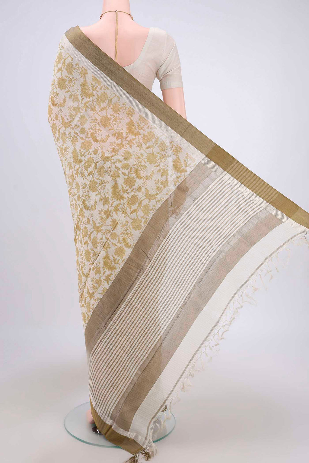 Flat view of Cream Tussar Saree with Floral Print on the body and Thread Border. 