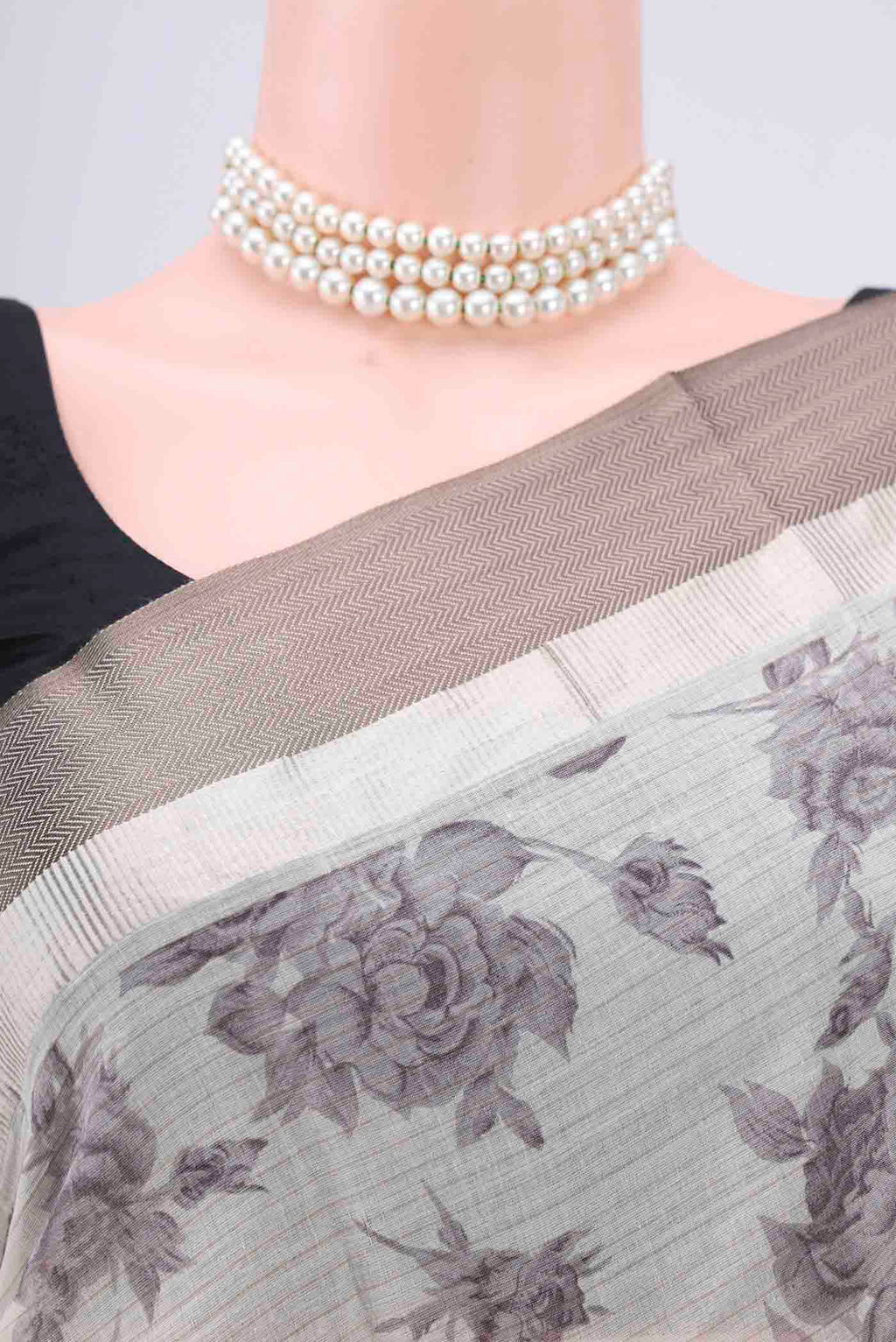 Border image of Beige Tussar Saree with Floral Print on the body and Thread Border. 