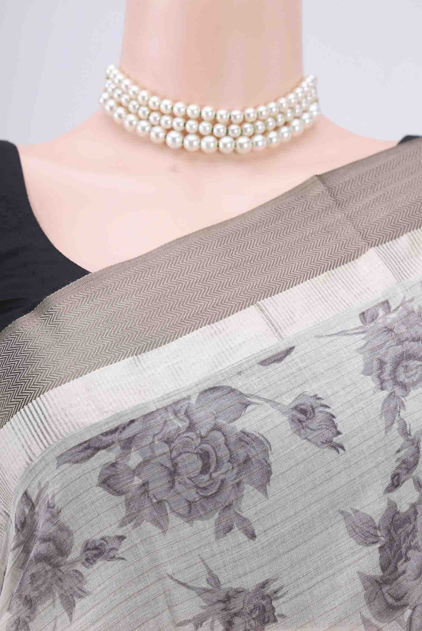 Border image of Beige Tussar Saree with Floral Print on the body and Thread Border. 