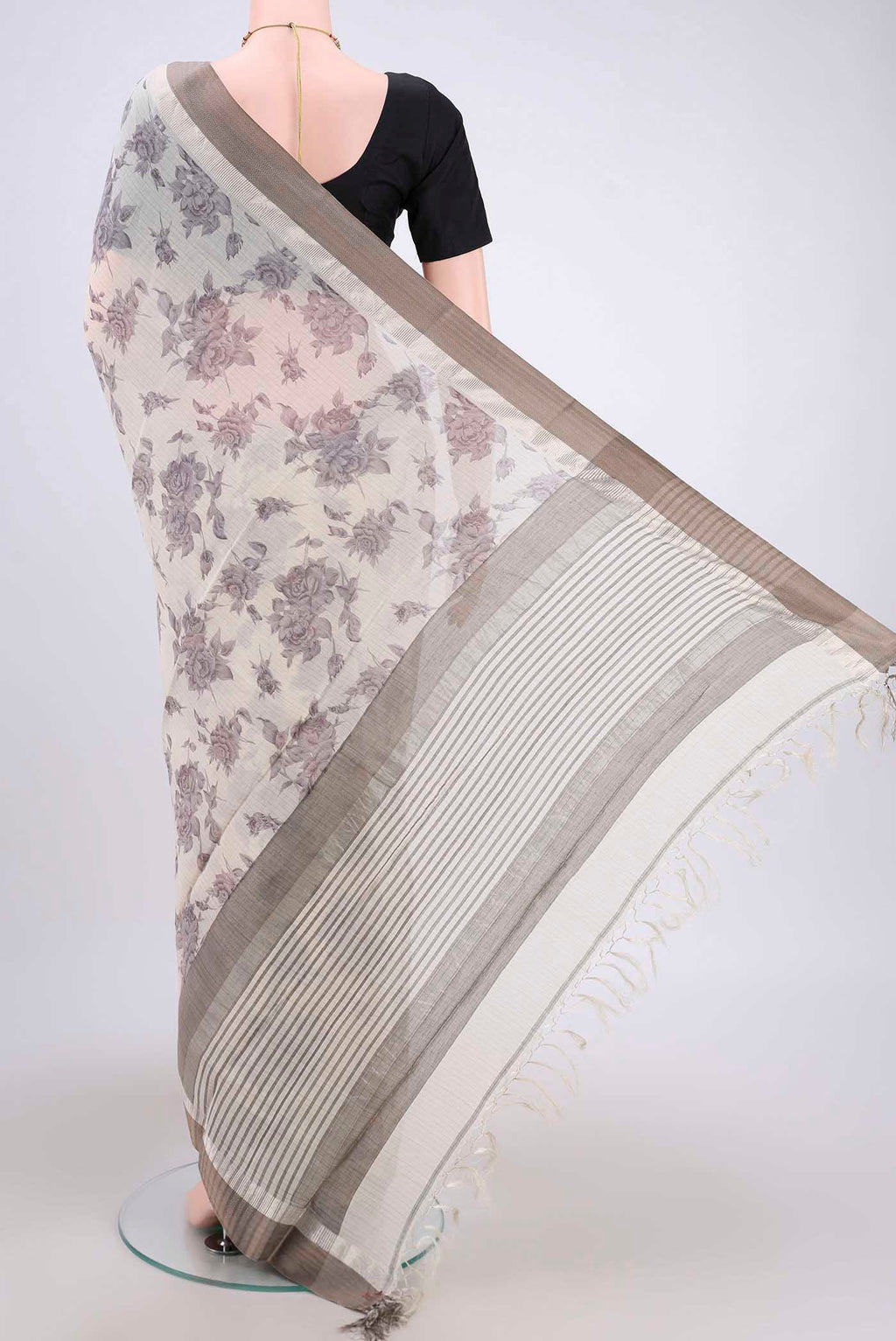 Flat view of Beige Tussar Saree with Floral Print on the body and Thread Border. 