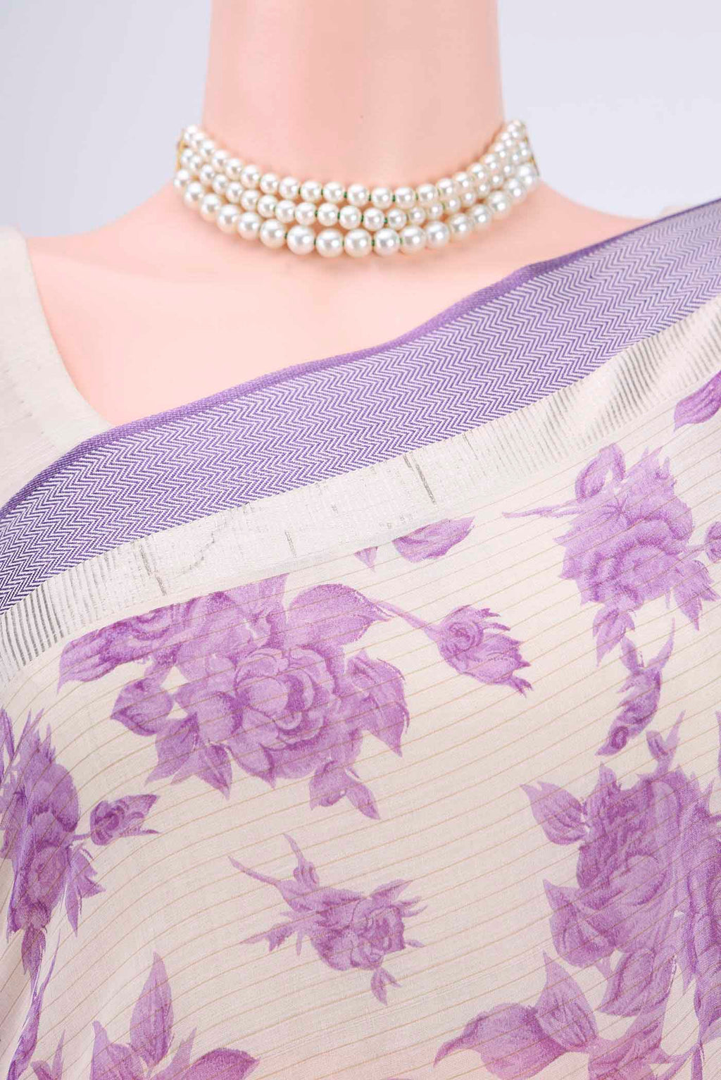 Border image of Off White Tussar Saree with Floral Print on the body and Plain Border. 