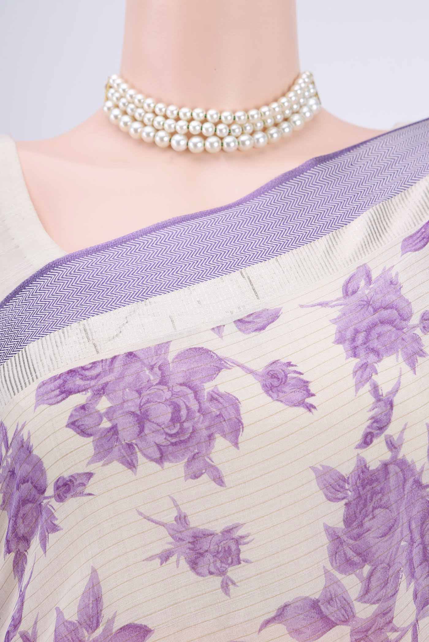 Border image of Off White Tussar Saree with Floral Print on the body and Plain Border. 