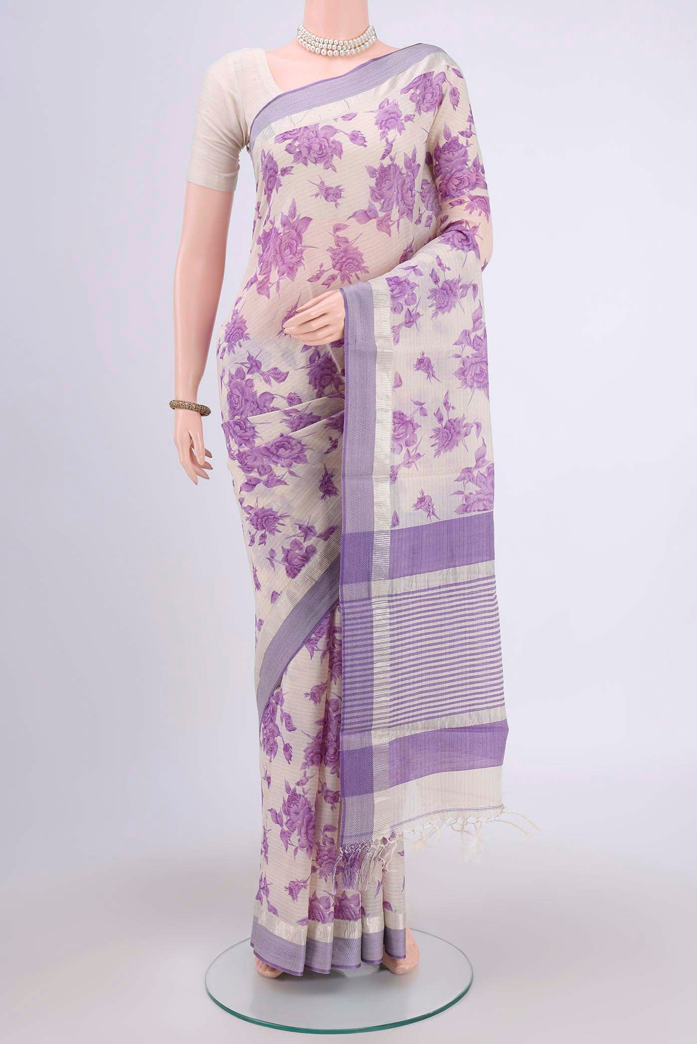 Off White Tussar Saree with Floral Print on the body and Plain Border.  displayed on a mannequin