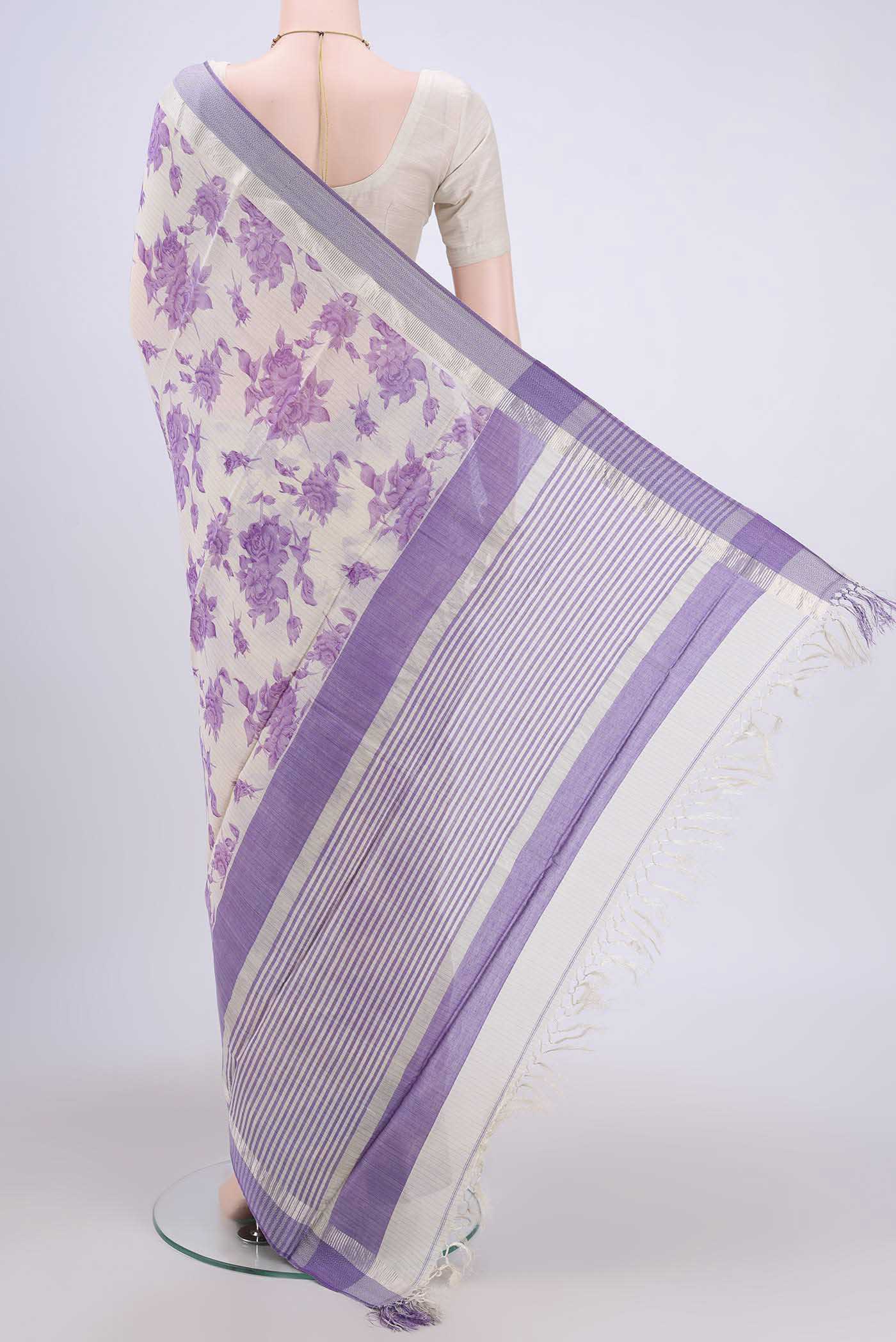 Flat view of Off White Tussar Saree with Floral Print on the body and Plain Border. 