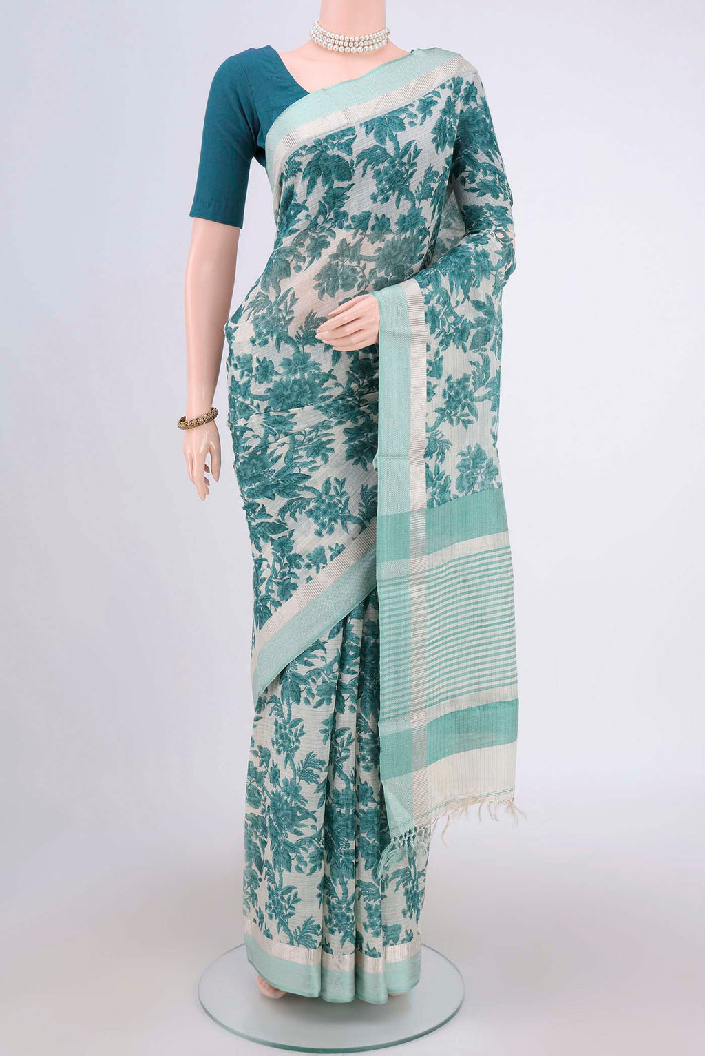 Beige Tussar Saree with Floral Print on the body and Thread Border.  displayed on a mannequin
