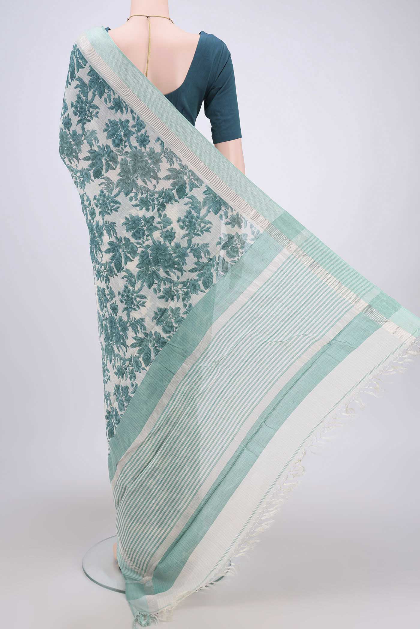 Flat view of Beige Tussar Saree with Floral Print on the body and Thread Border. 