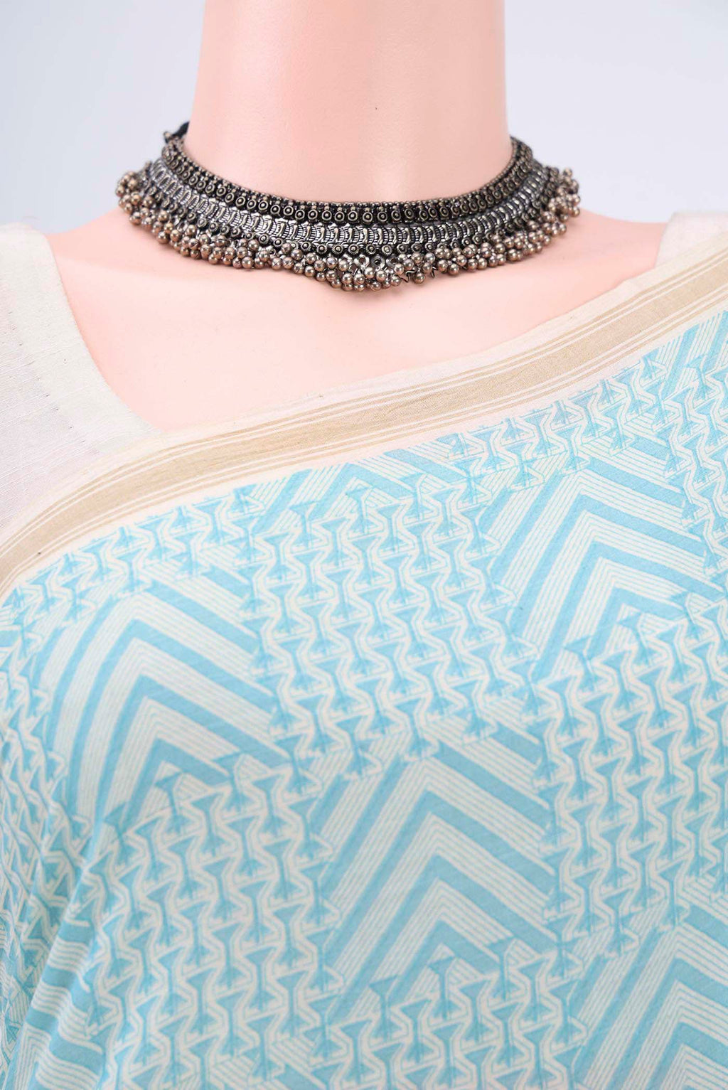 Border image of Blue Tussar Saree with Floral Print on the body and Plain Border. 