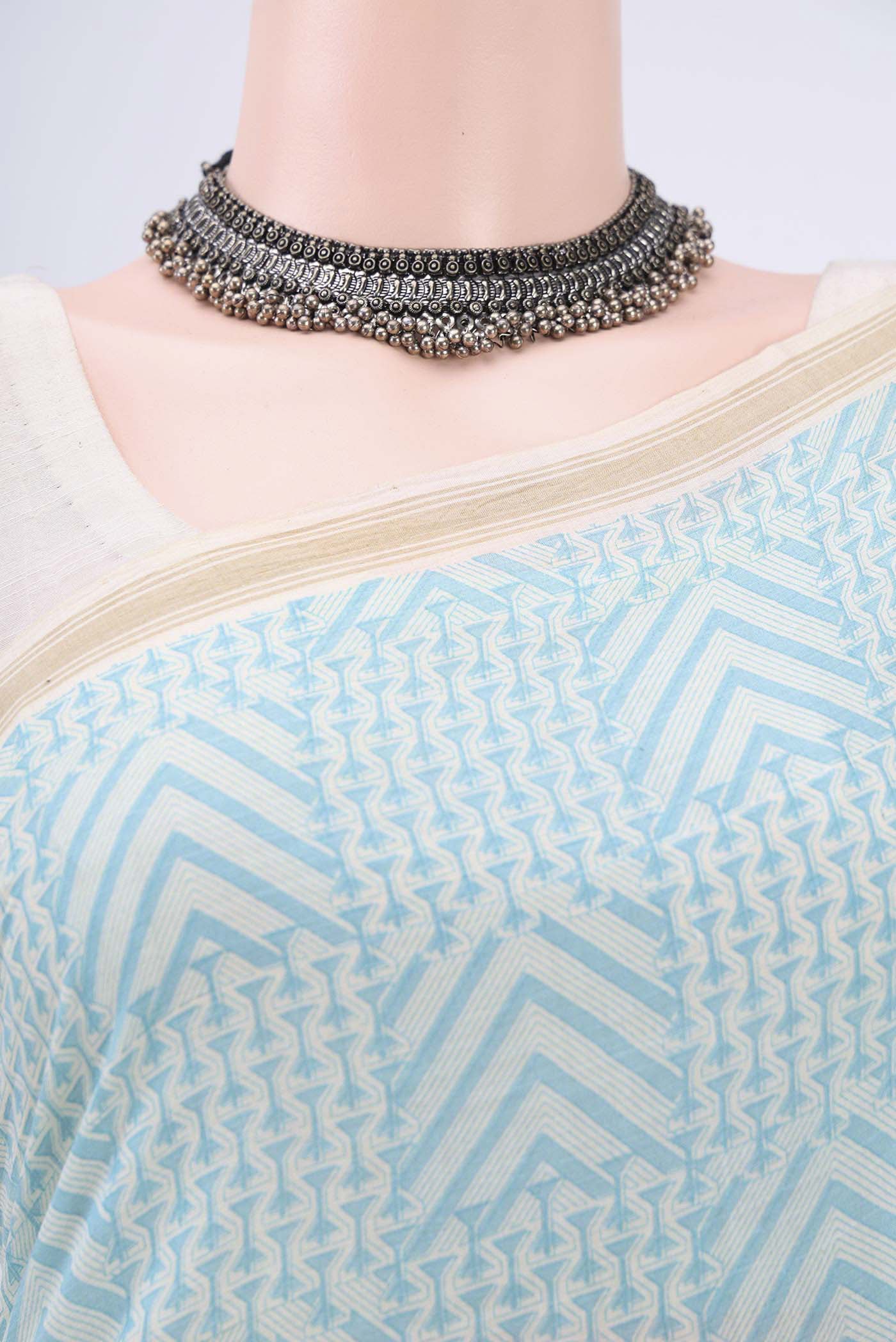 Border image of Blue Tussar Saree with Floral Print on the body and Plain Border. 