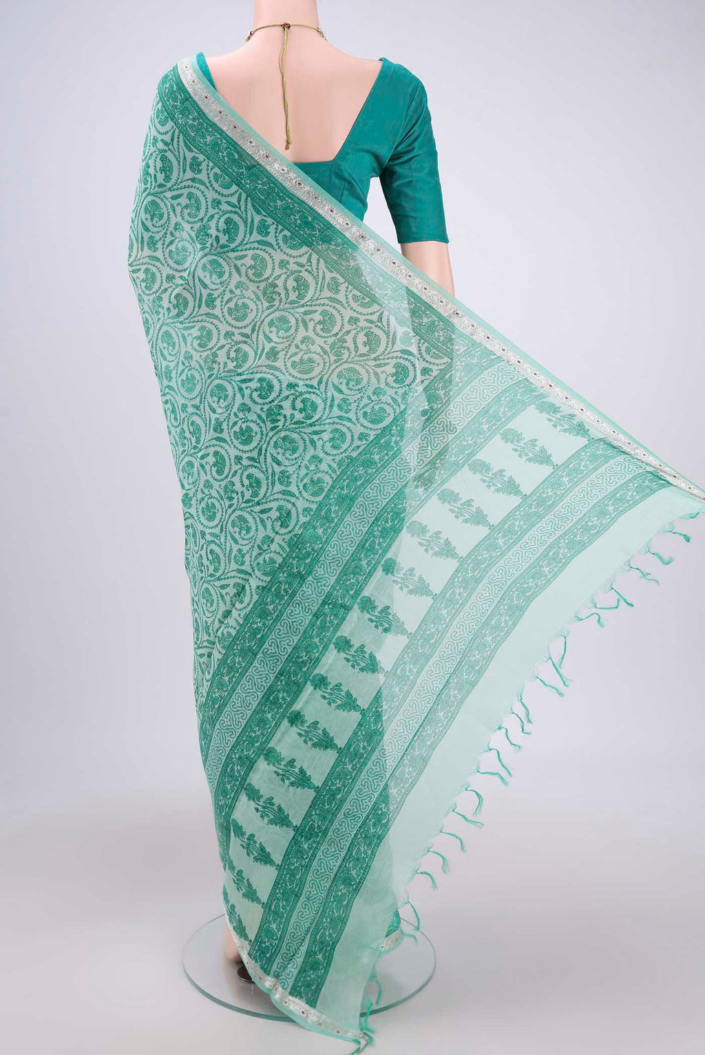 Flat view of Sea Green Chanderi Silk Saree with Floral Print on the body and Zari Border. 