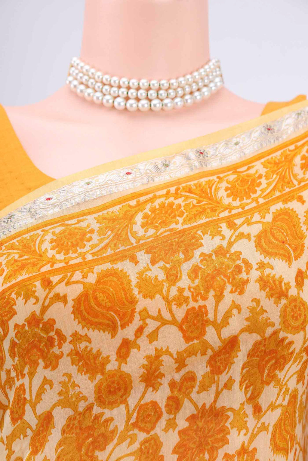 Border image of Yellow Tussar Saree with Floral Print on the body and Thread Border. 
