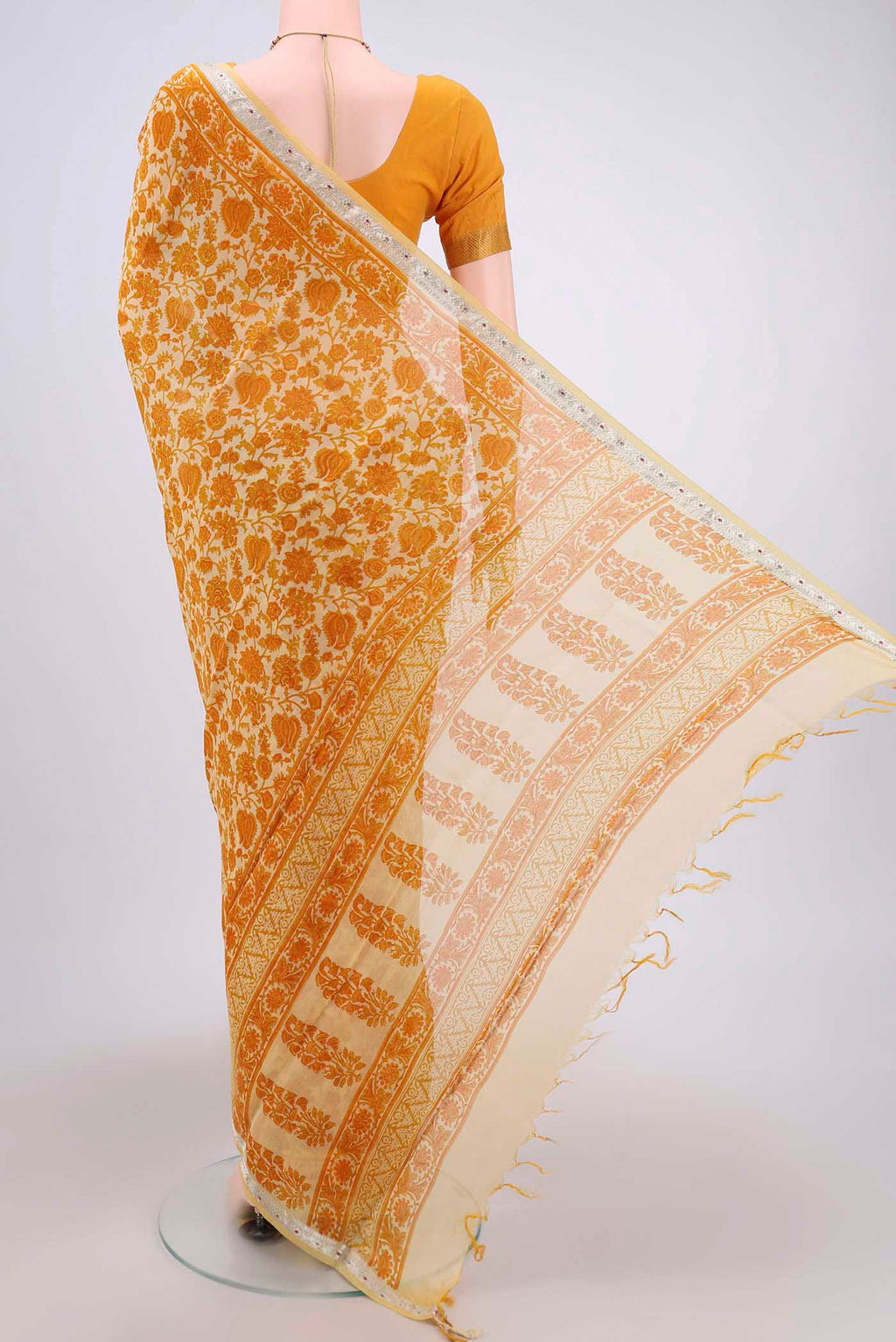 Flat view of Yellow Tussar Saree with Floral Print on the body and Thread Border. 