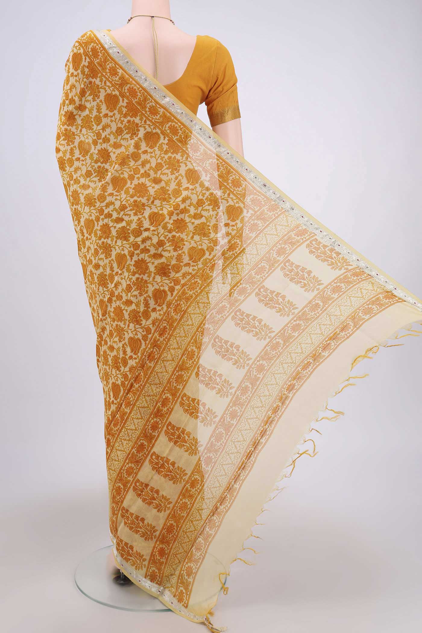 Flat view of Yellow Tussar Saree with Floral Print on the body and Thread Border. 