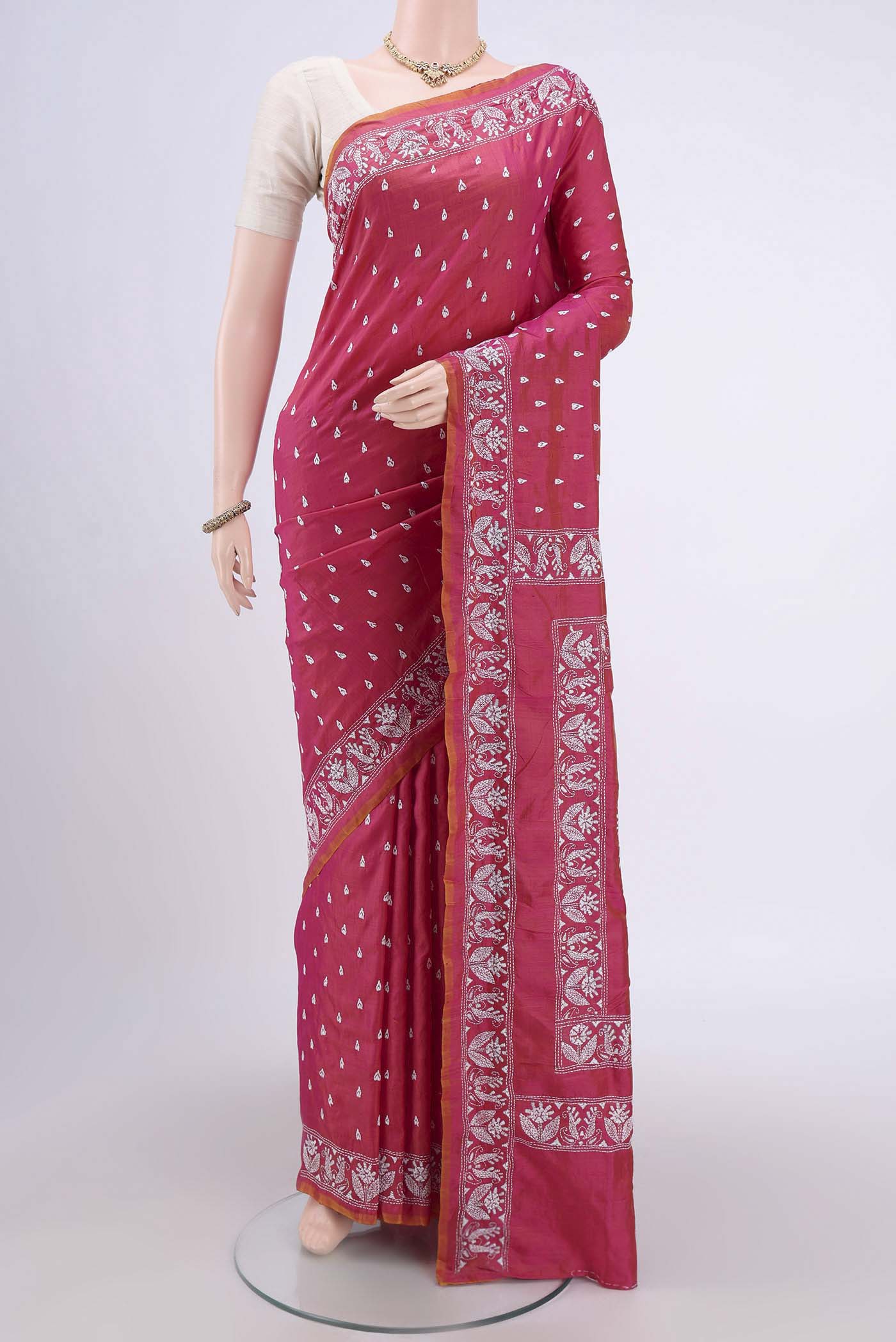 Dark Pink Kantha Silk Saree with Kantha Work on the body and Thread Border.  displayed on a mannequin