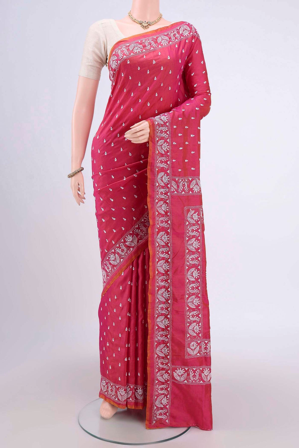 Dark Pink Kantha Silk Saree with Kantha Work on the body and Thread Border.  displayed on a mannequin