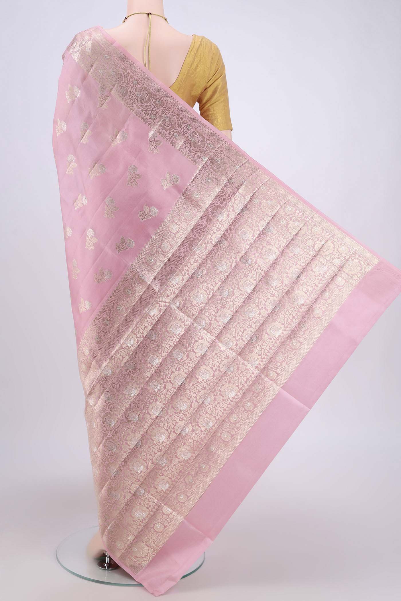 Flat view of Rose pink Banarasi Raw Silk Saree with Zari Butta on the body and Zari Border. 