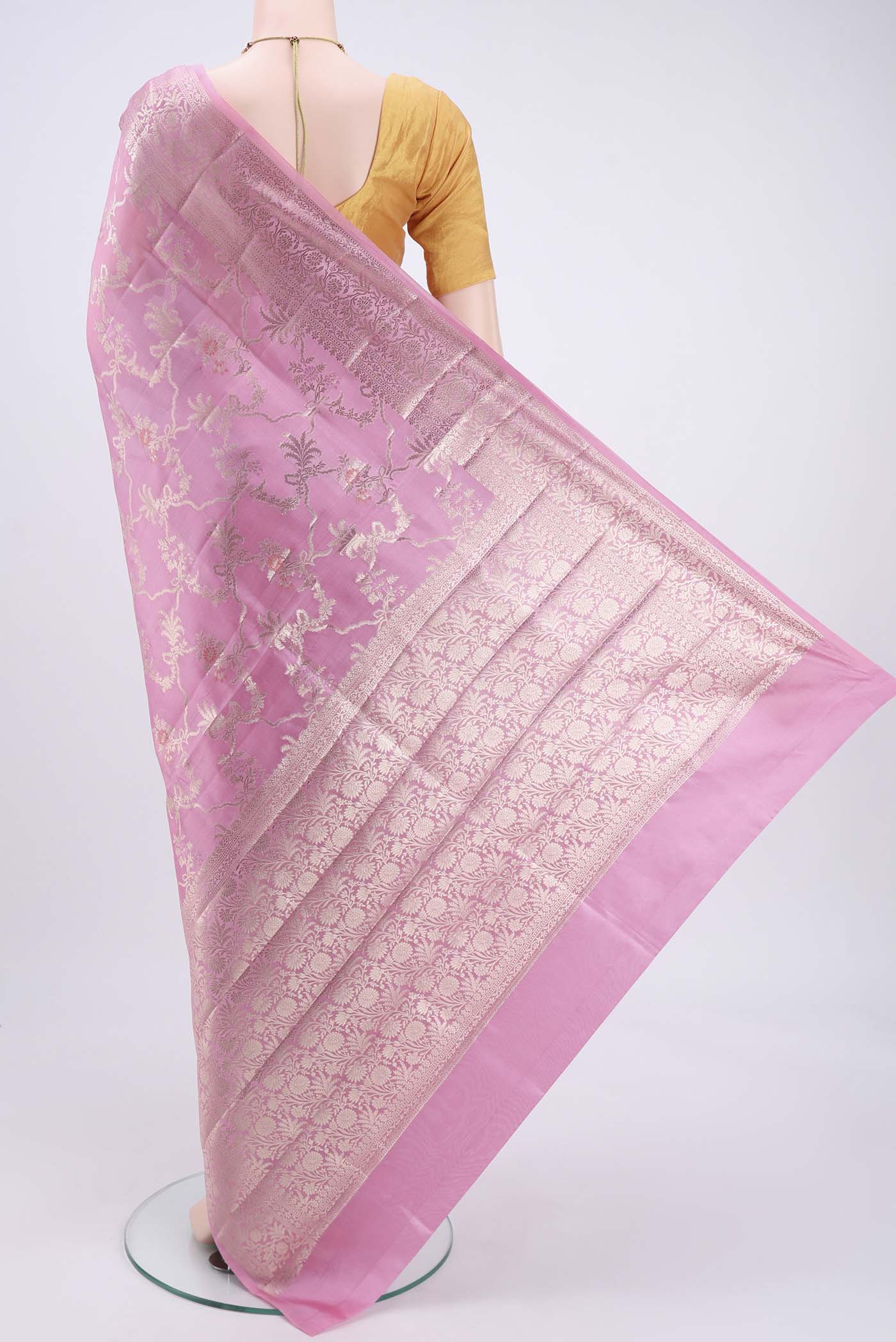 Flat view of Rose pink Banarasi Raw Silk Saree with Zari Butta on the body and Zari Border. 