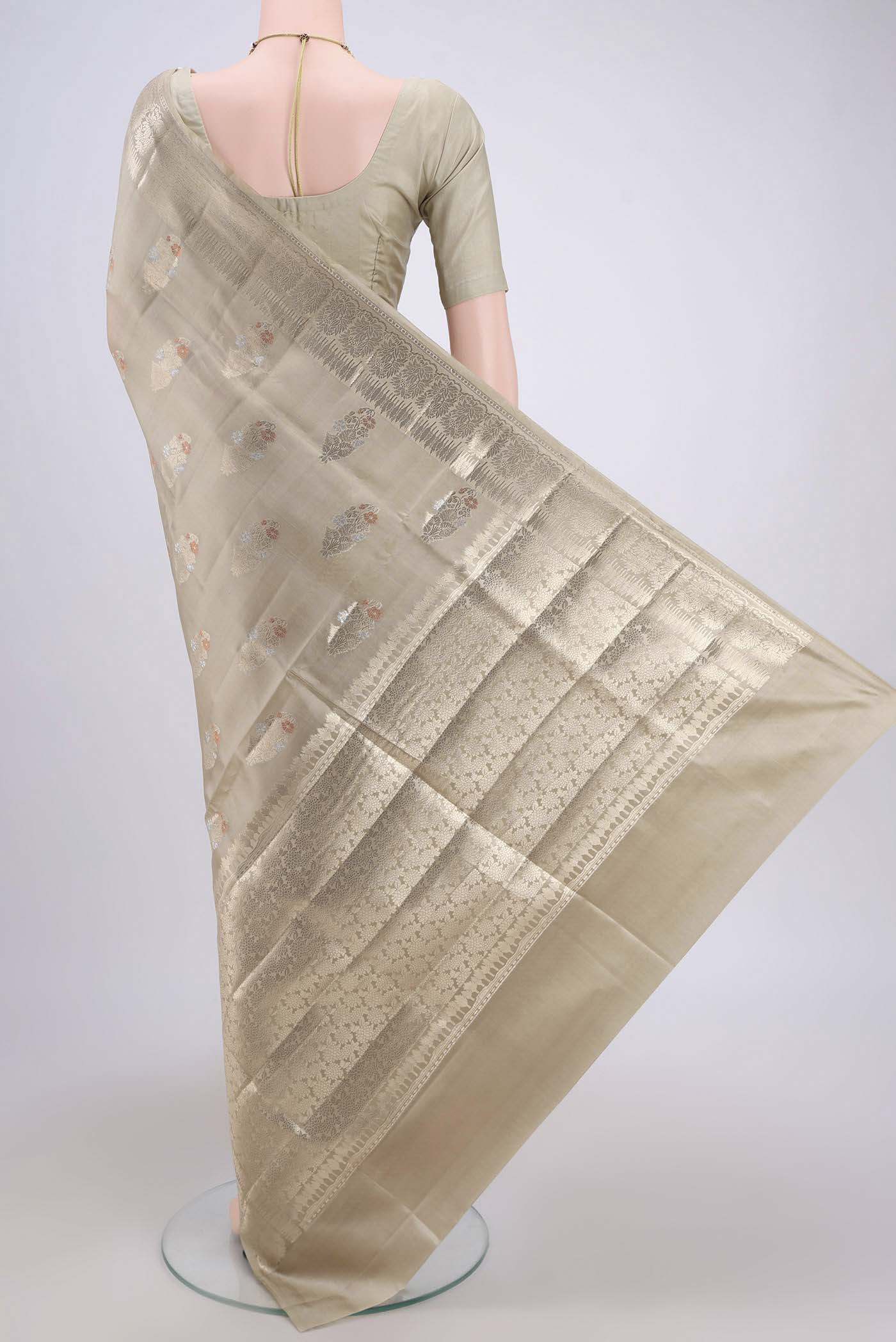 Flat view of Dark Beige Banarasi Raw Silk Saree with Zari Butta on the body and Zari Border. 