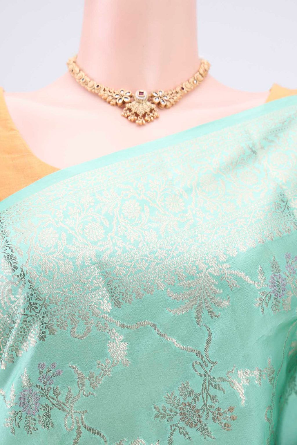 Border image of Mint Green Banarasi Raw Silk Saree with Zari Butta on the body and Zari Border. 