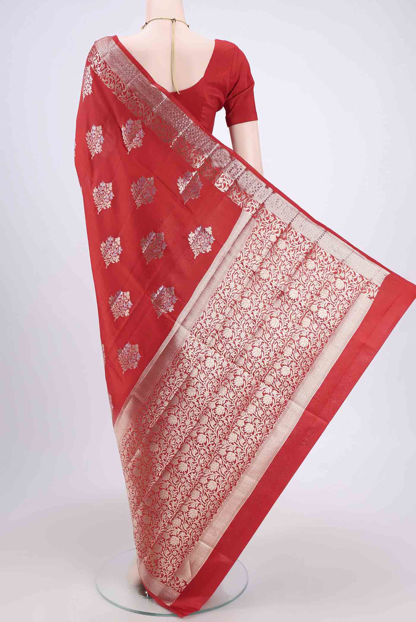 Flat view of Red Banarasi Raw Silk Saree with Zari Butta on the body and Zari Border. 