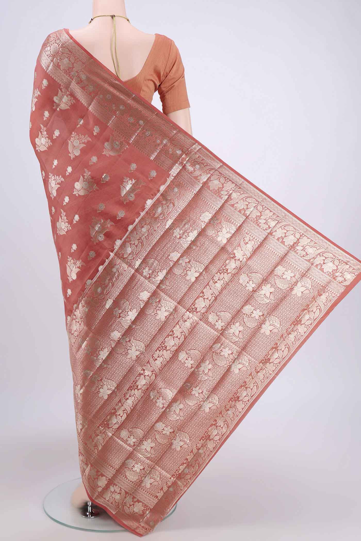 Flat view of Peach Banarasi Raw Silk Saree with Zari Butta on the body and Zari Border. 
