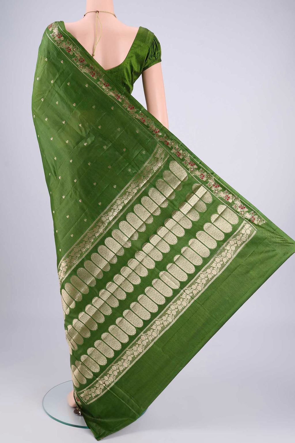 Flat view of Green Banarasi Tussar Silk Saree with Zari And Thread Butta on the body and Zari And Thread Border. 