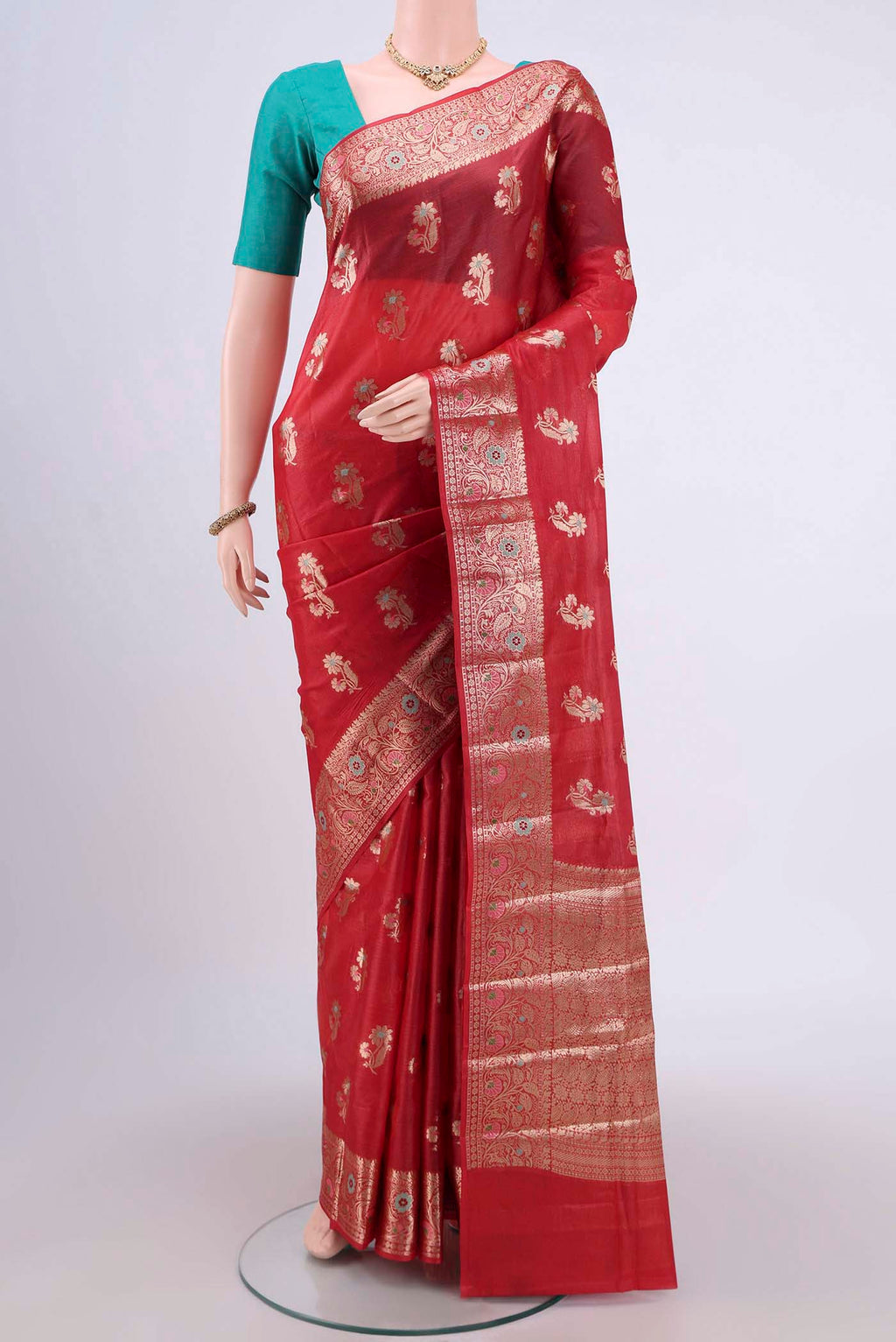 Red Banarasi Tussar Silk Saree with Zari And Thread Butta on the body and Zari And Thread Border.  displayed on a mannequin