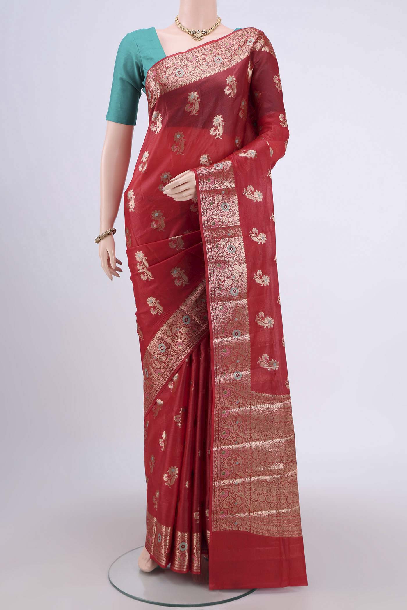 Red Banarasi Tussar Silk Saree with Zari And Thread Butta on the body and Zari And Thread Border.  displayed on a mannequin