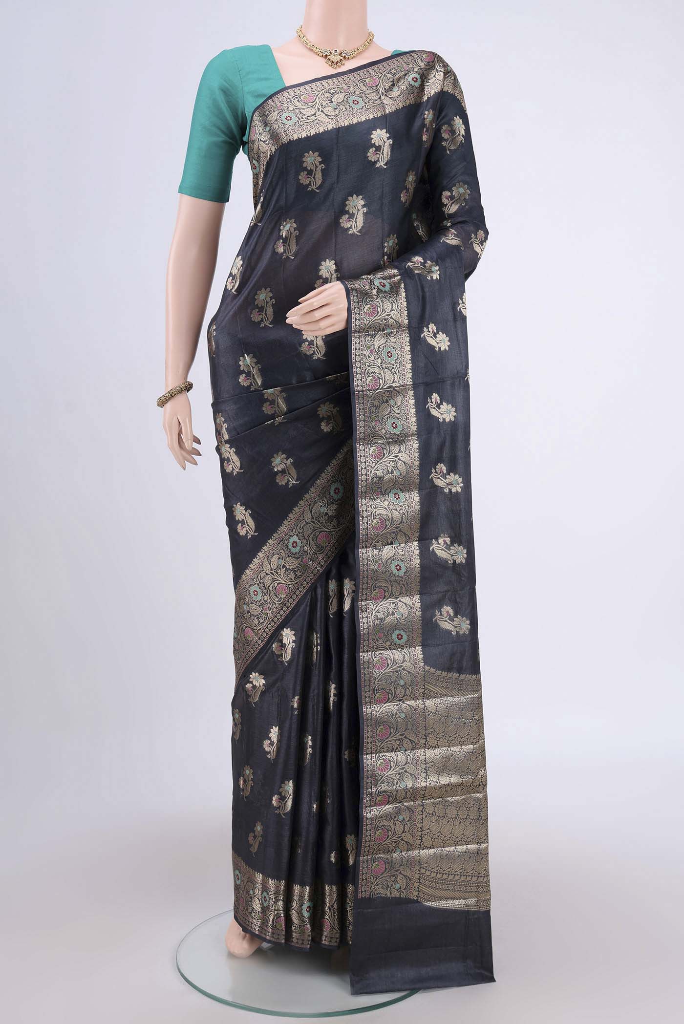 Davys Grey Banarasi Tussar Silk Saree with Zari And Thread Butta on the body and Zari And Thread Border.  displayed on a mannequin