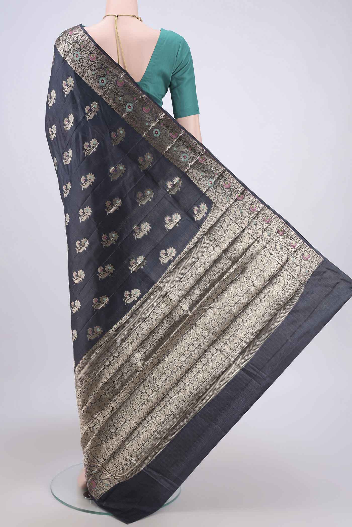 Flat view of Davys Grey Banarasi Tussar Silk Saree with Zari And Thread Butta on the body and Zari And Thread Border. 