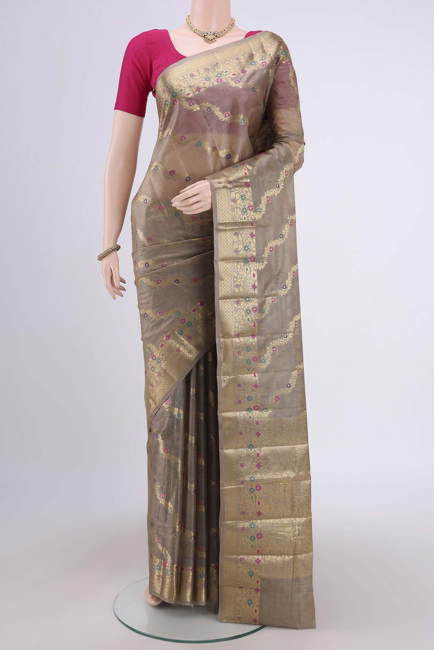 Dark Beige Banarasi Tussar Silk Saree with Zari Brocade on the body and Zari And Thread Border.  displayed on a mannequin