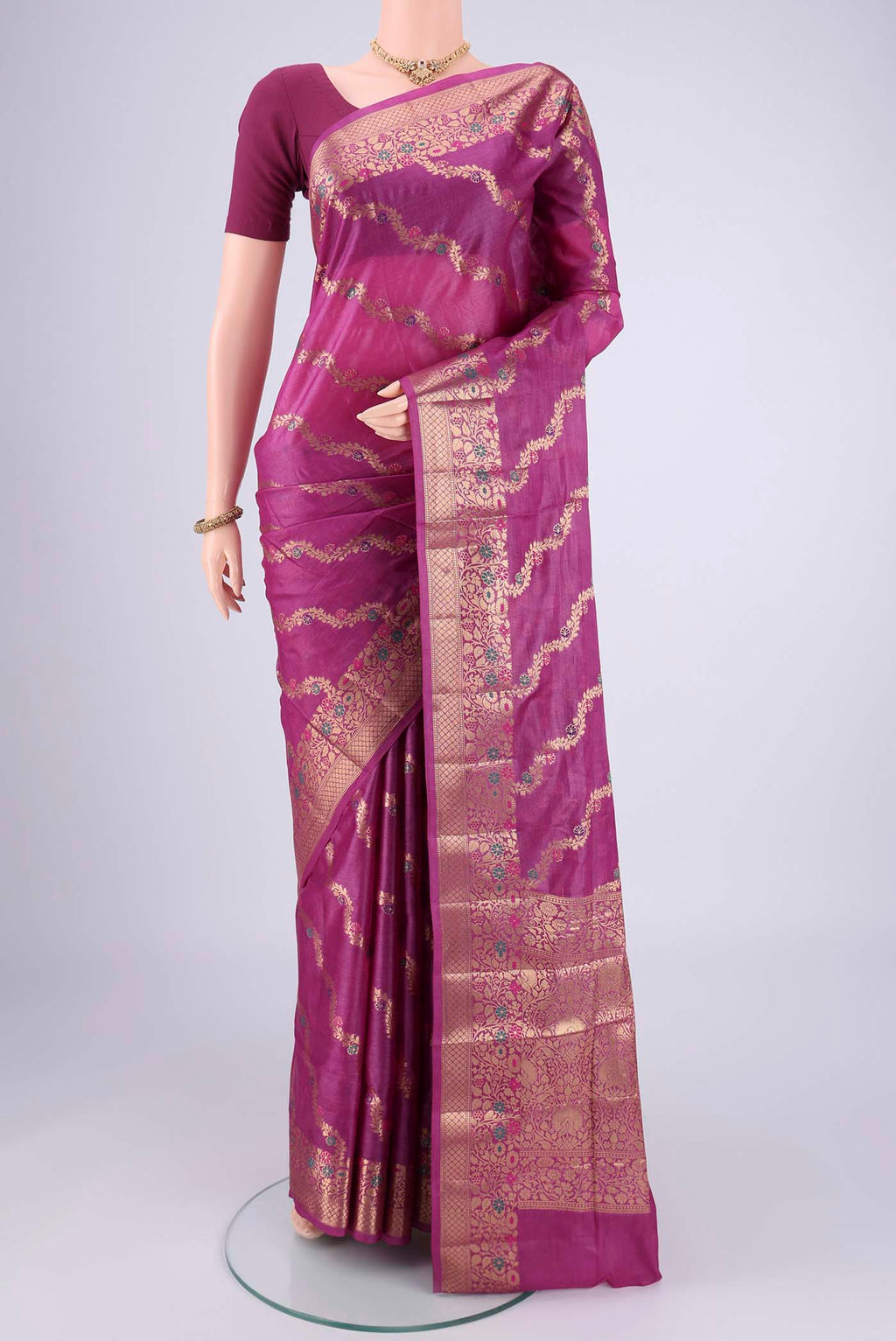 Magenta Banarasi Tussar Silk Saree with Zari Brocade on the body and Zari And Thread Border.  displayed on a mannequin