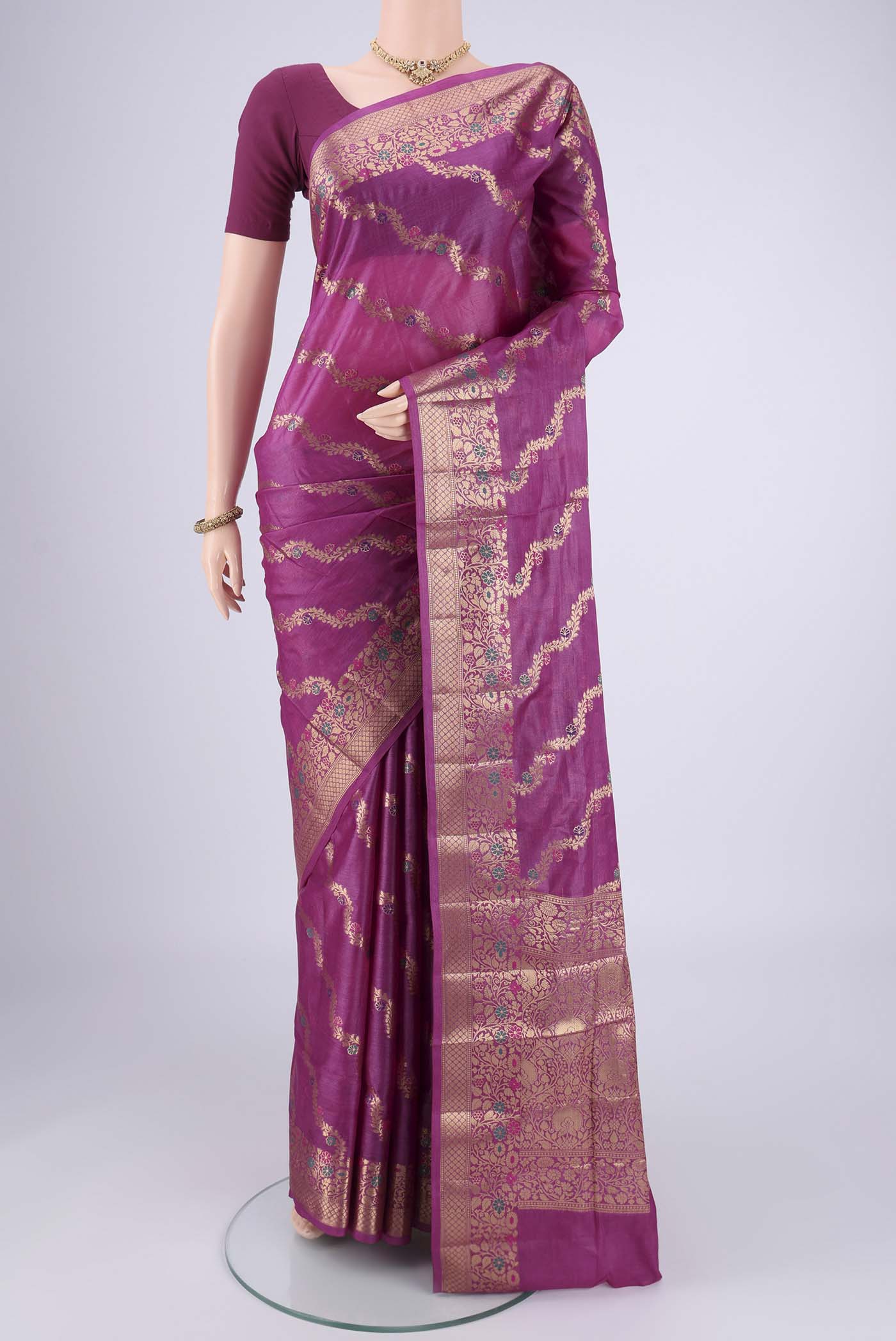 Magenta Banarasi Tussar Silk Saree with Zari Brocade on the body and Zari And Thread Border.  displayed on a mannequin