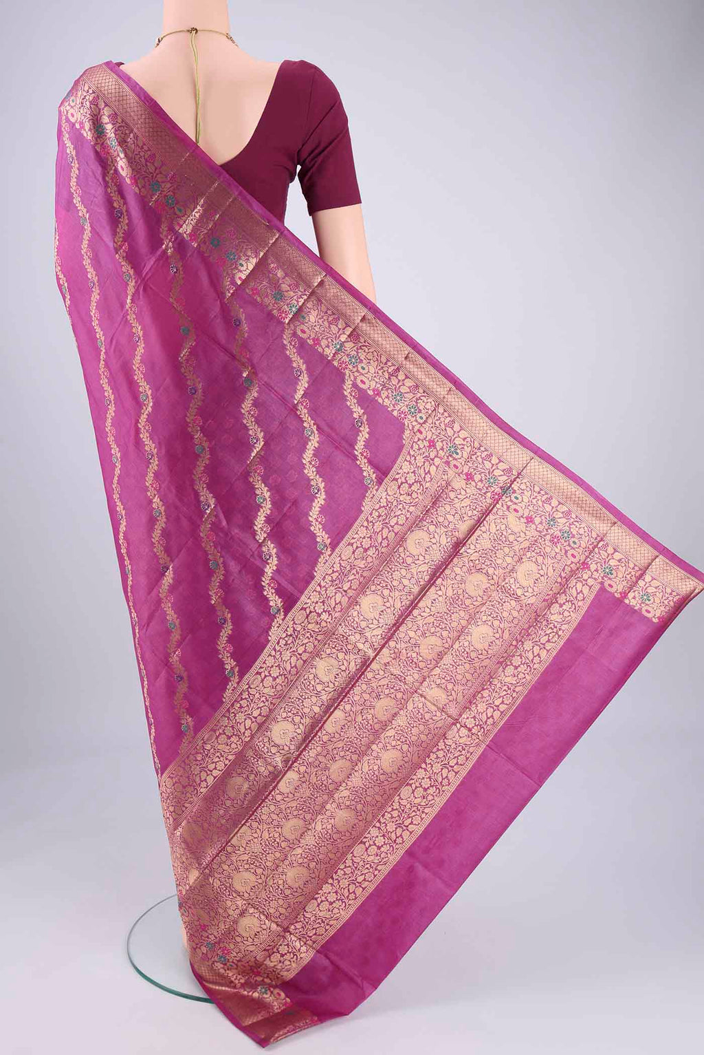 Flat view of Magenta Banarasi Tussar Silk Saree with Zari Brocade on the body and Zari And Thread Border. 