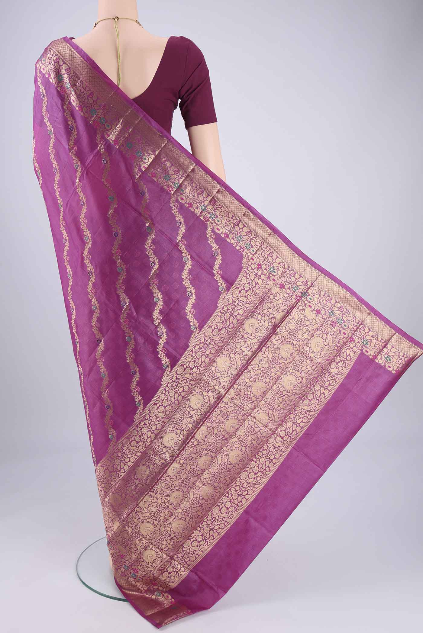 Flat view of Magenta Banarasi Tussar Silk Saree with Zari Brocade on the body and Zari And Thread Border. 