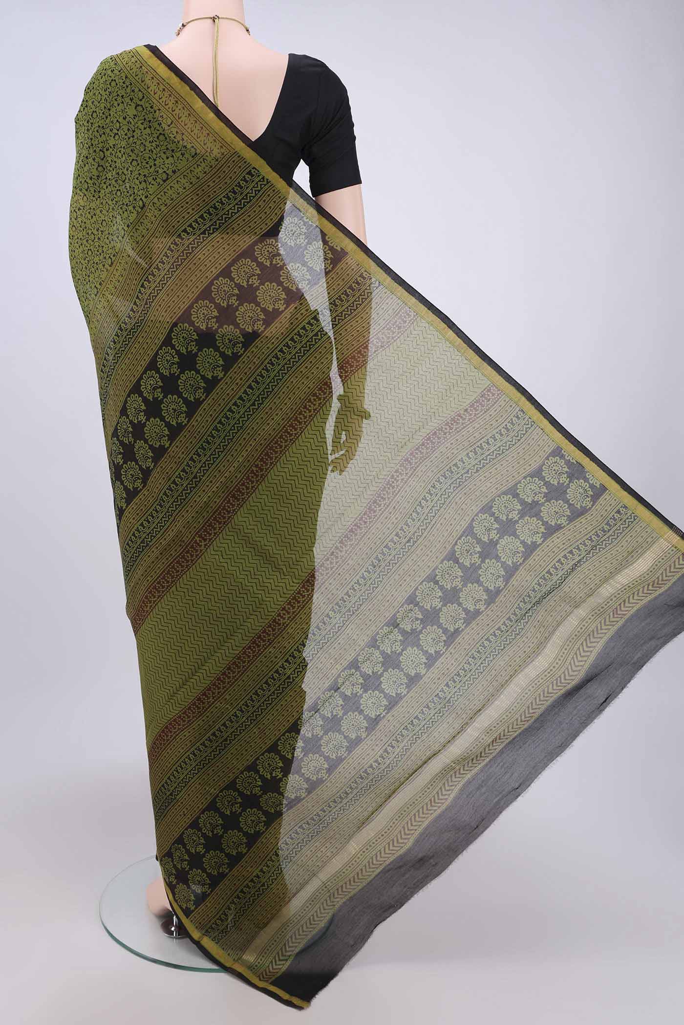 Flat view of Mehandi Green Maheshwari Silk Cotton Saree with Printed design on the body and Zari Border. 