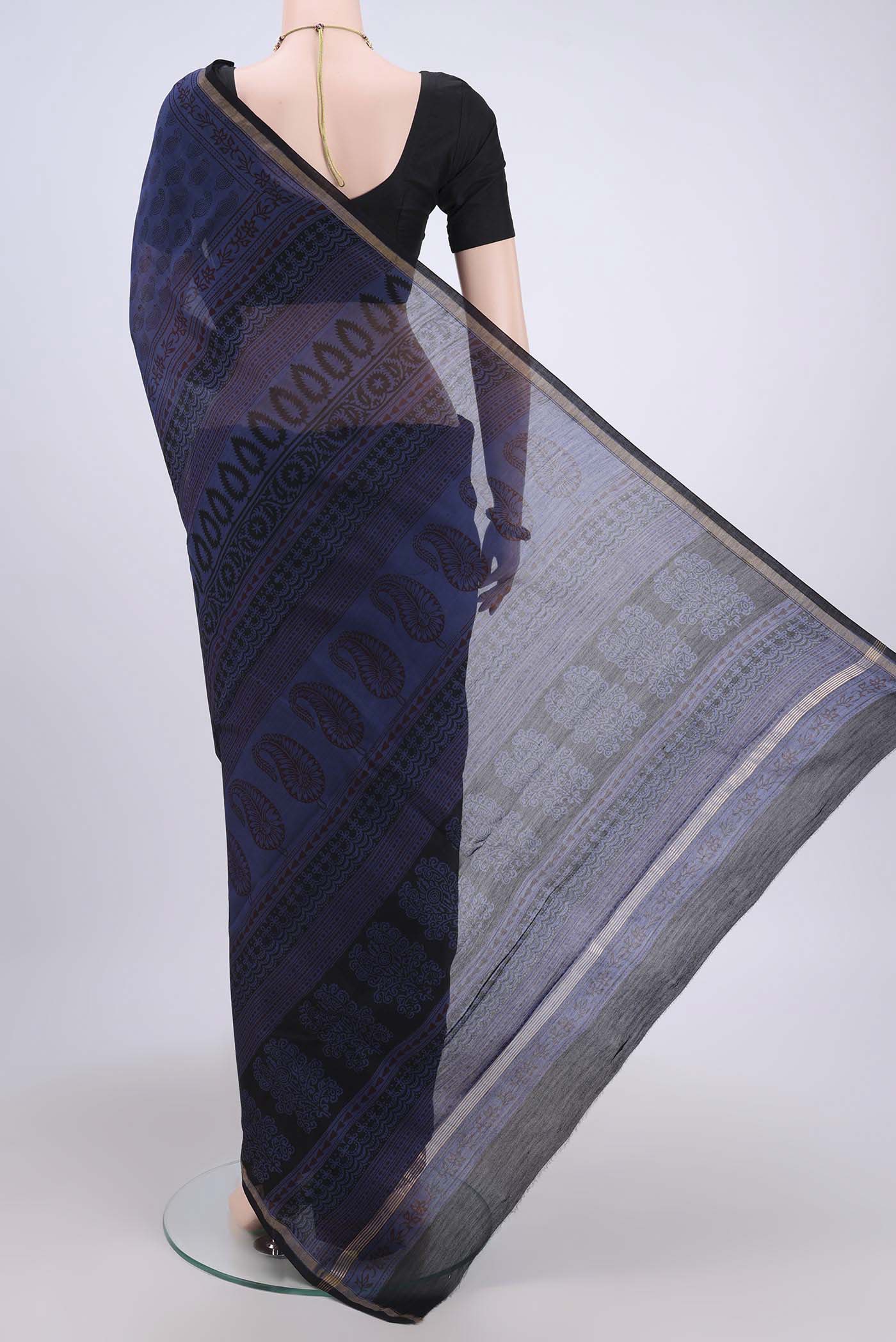 Flat view of Blue Maheshwari Silk Cotton Saree with Printed design on the body and Zari Border. 