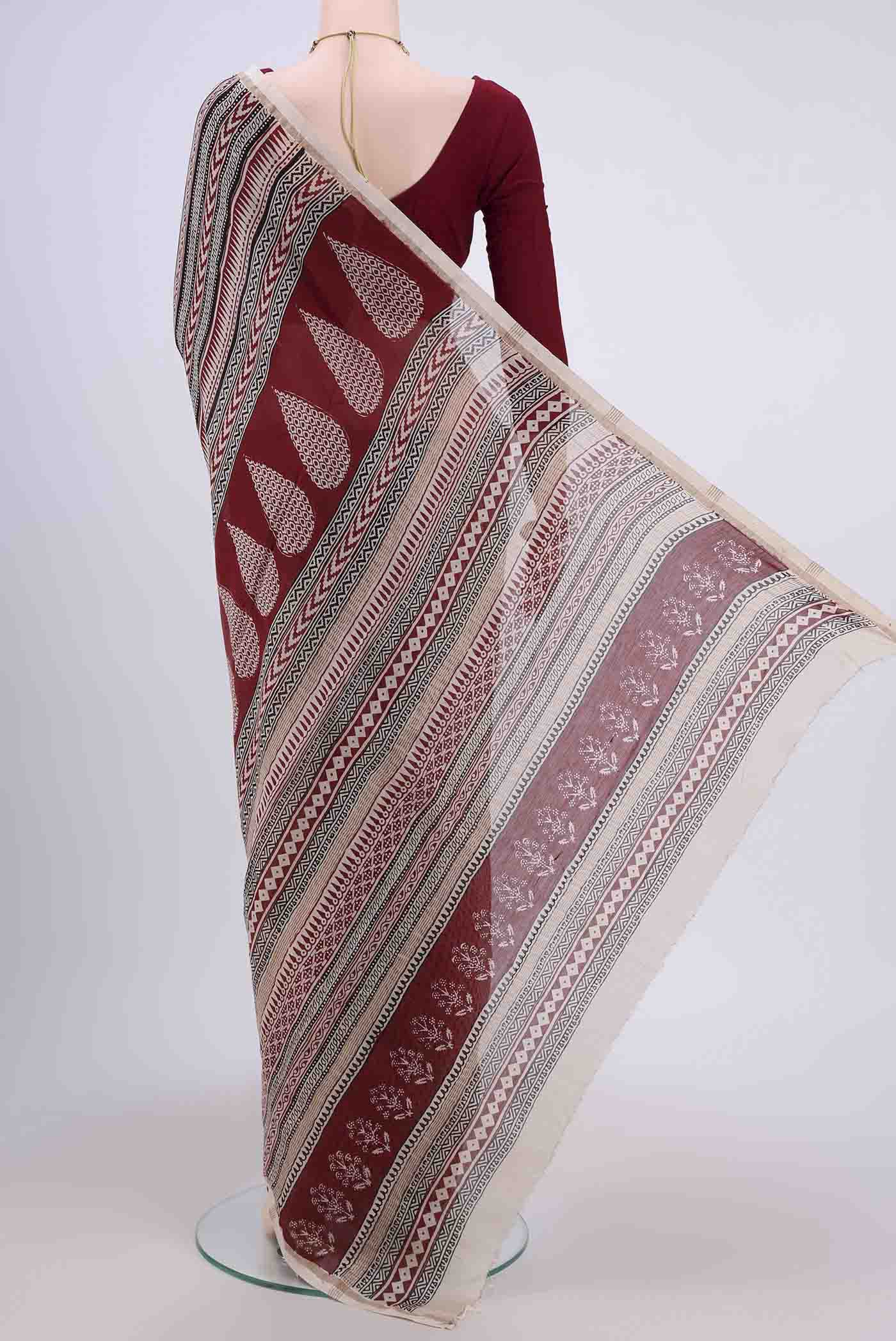 Flat view of Off White Maheshwari Silk Cotton Saree with Printed design on the body and Zari Border. 