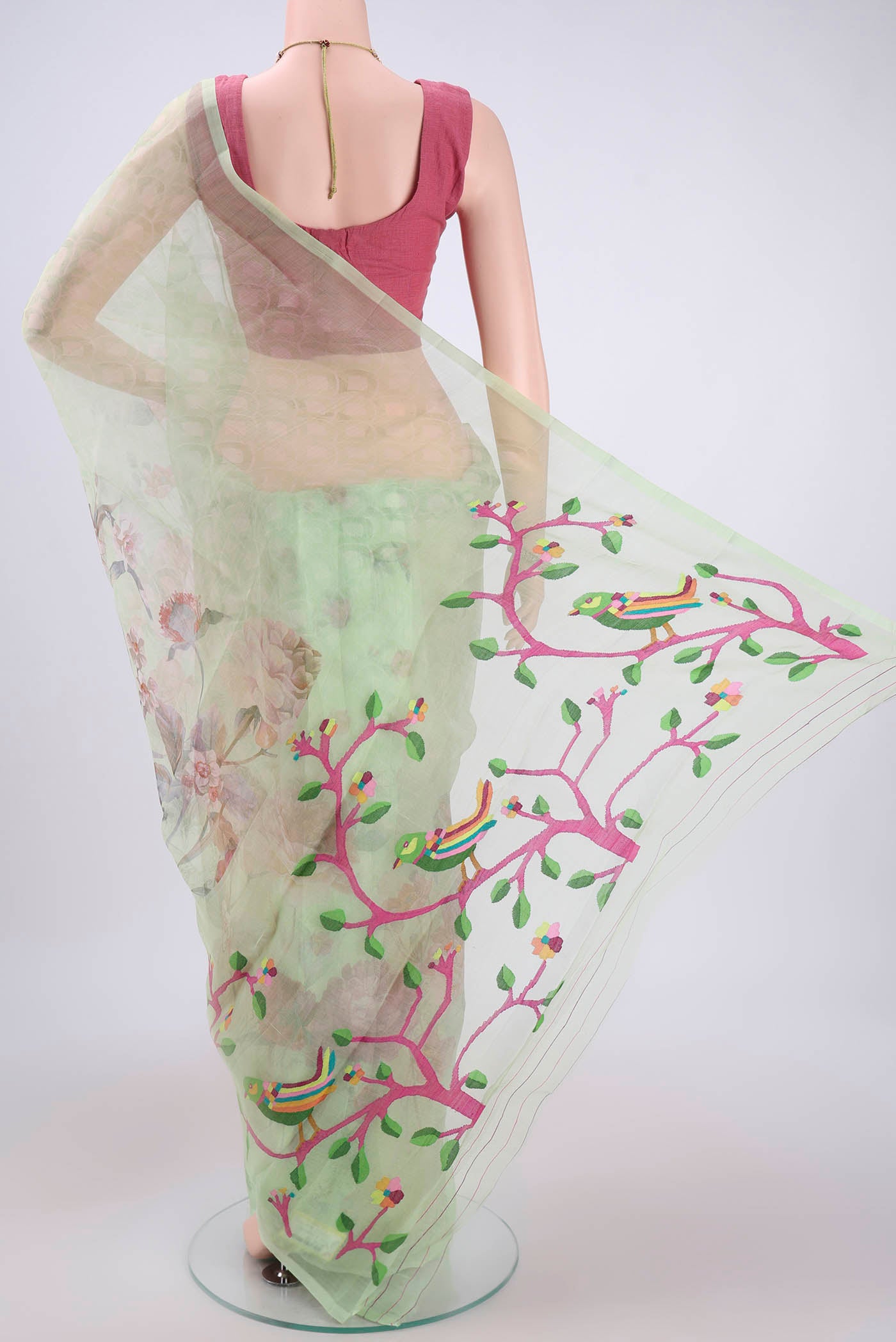Flat view of Mint Green Organza Silk Saree with Printed design on the body and Plain Border. 