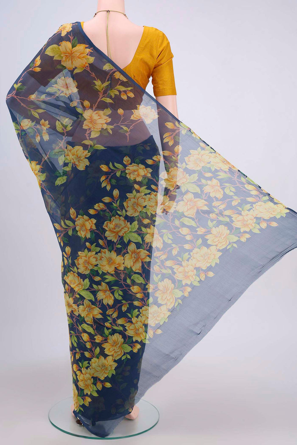 Flat view of Navy Blue Dual Tone Mysore Crepe Saree with Floral Print on the body and Plain Border. 