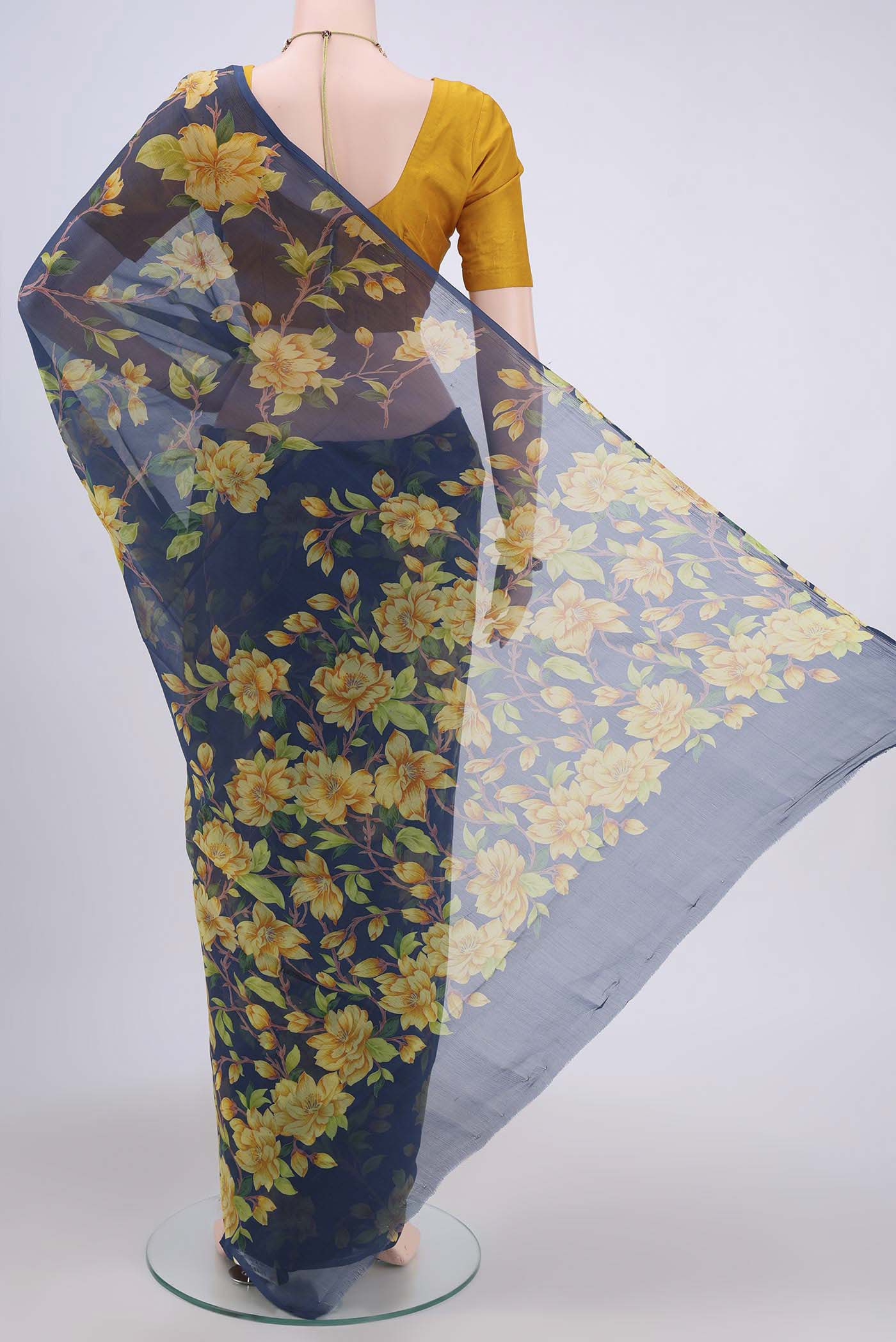 Flat view of Navy Blue Dual Tone Mysore Crepe Saree with Floral Print on the body and Plain Border. 