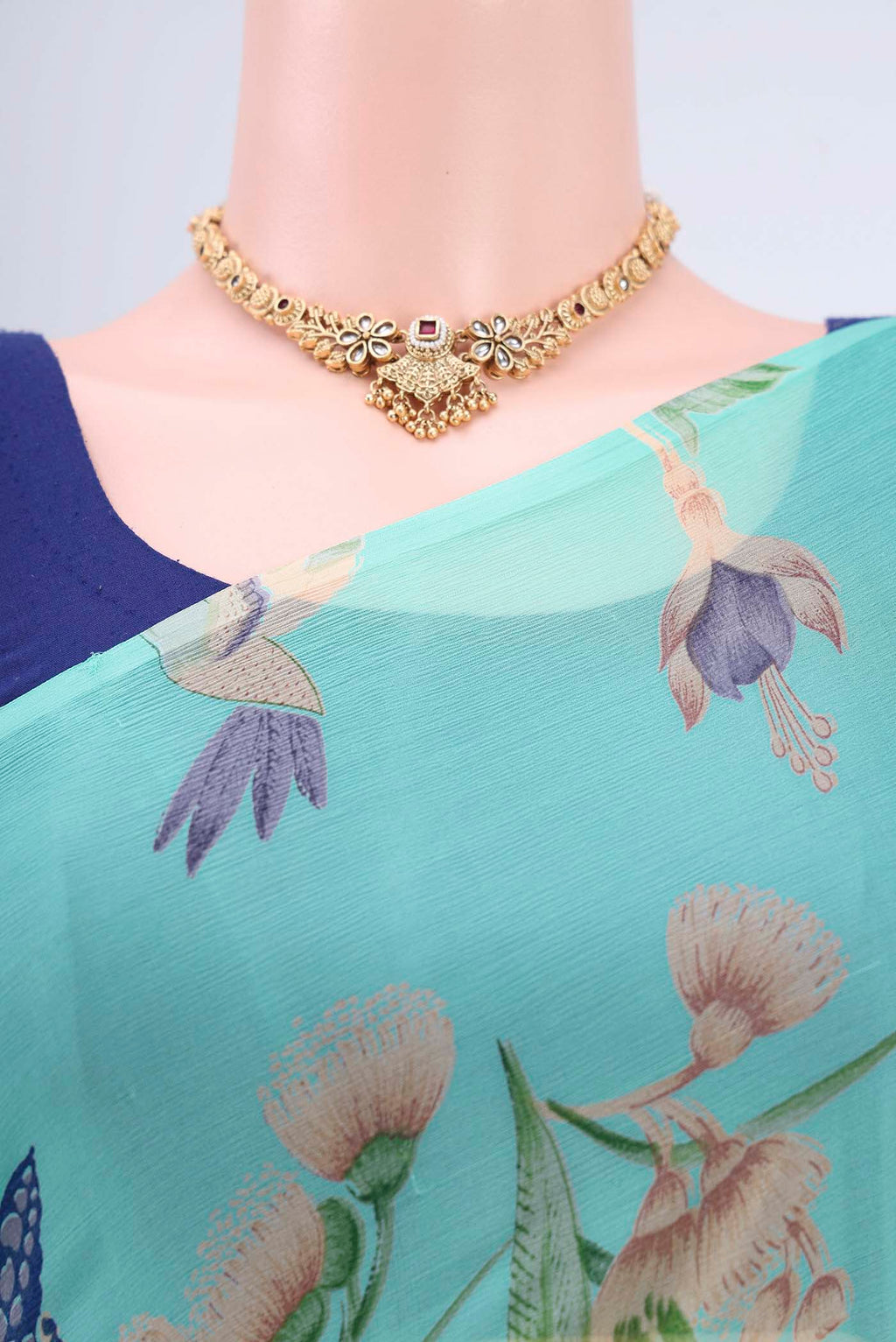 Border image of Turquoise Mysore Crepe Saree with Floral Print on the body and Zari Border. 