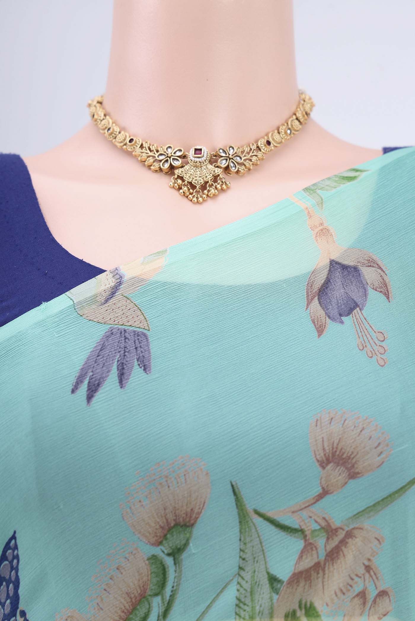 Border image of Turquoise Mysore Crepe Saree with Floral Print on the body and Zari Border. 