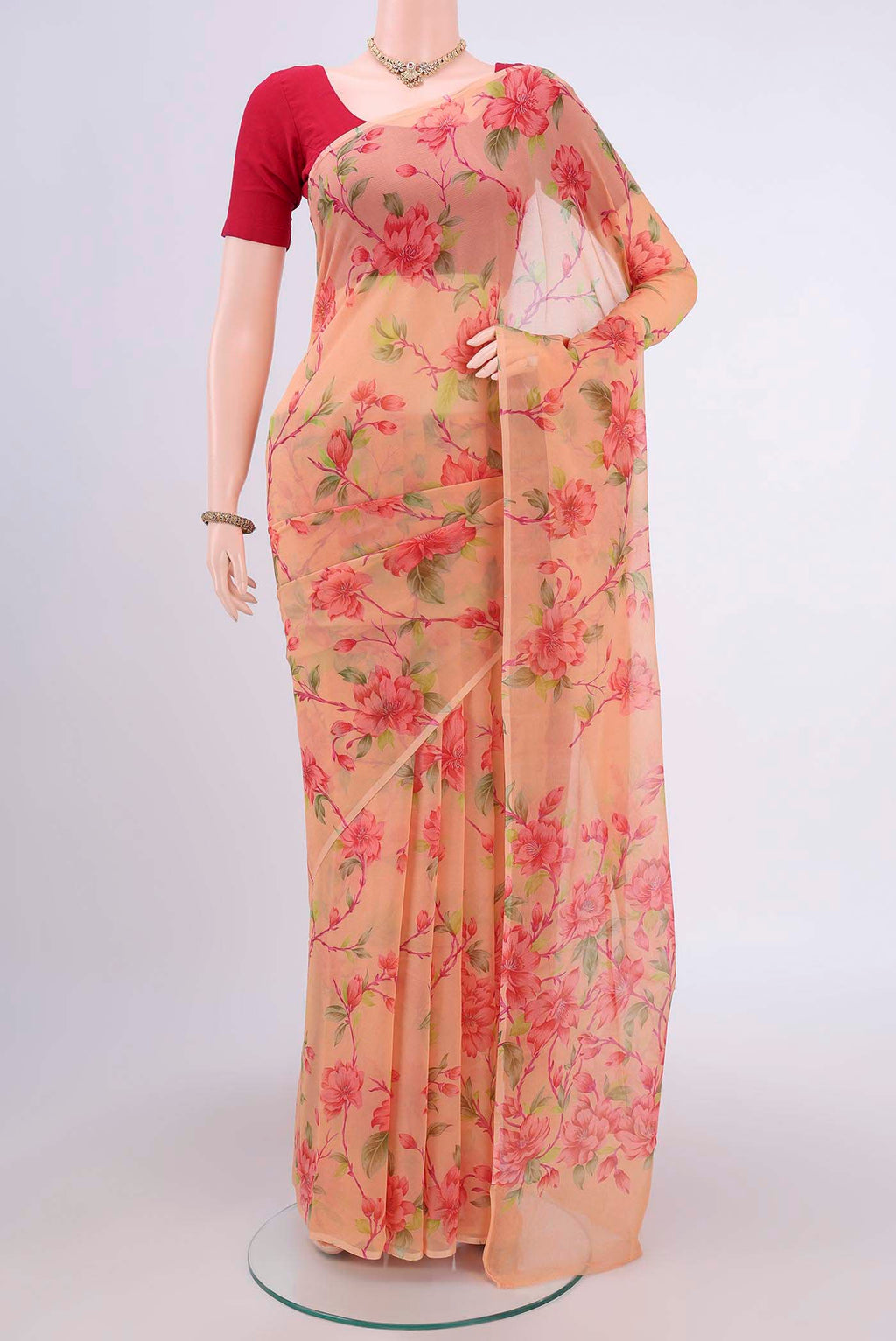 Peach Dual Tone Mysore Crepe Saree with Printed design on the body and Plain Border.  displayed on a mannequin