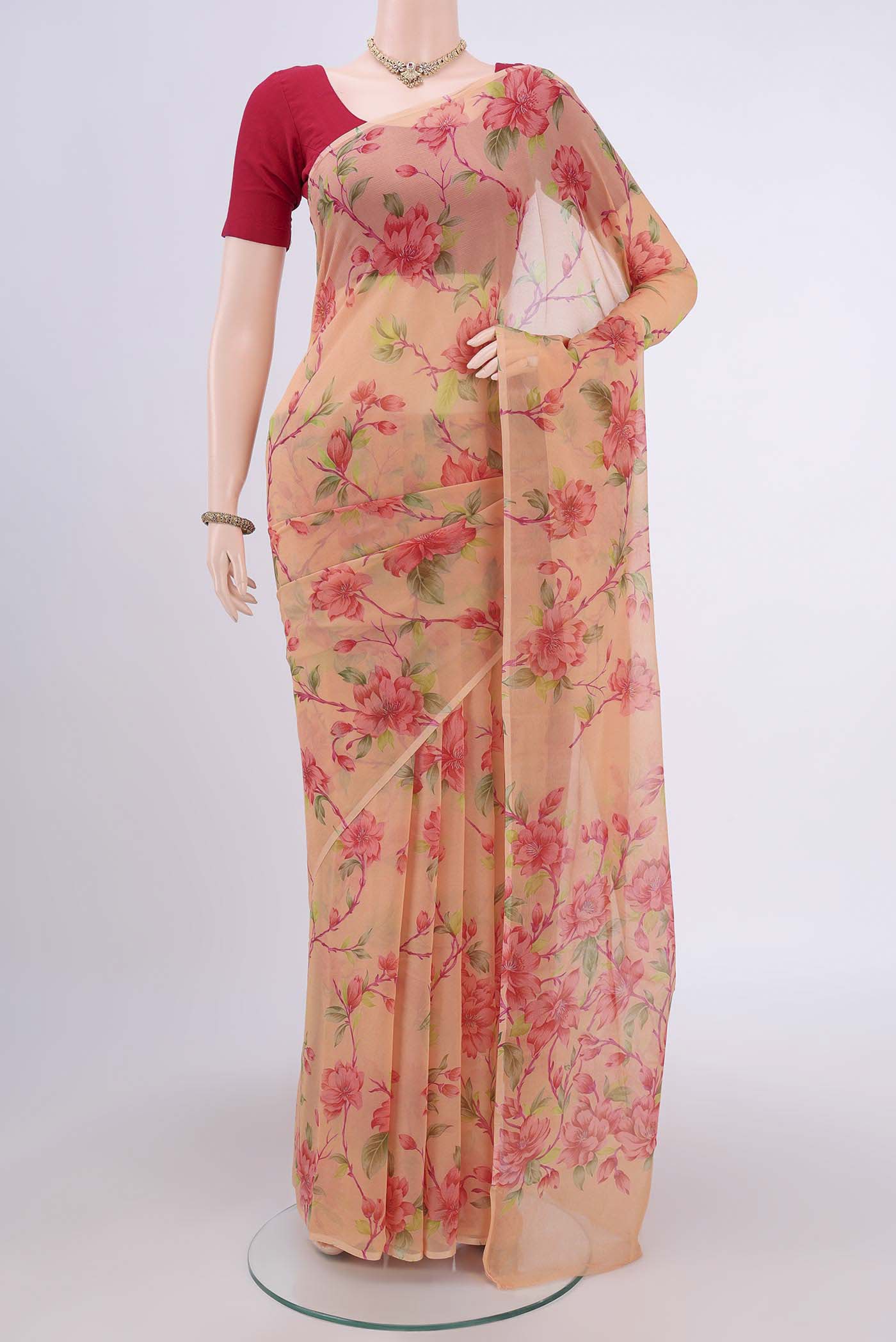 Peach Dual Tone Mysore Crepe Saree with Printed design on the body and Plain Border.  displayed on a mannequin