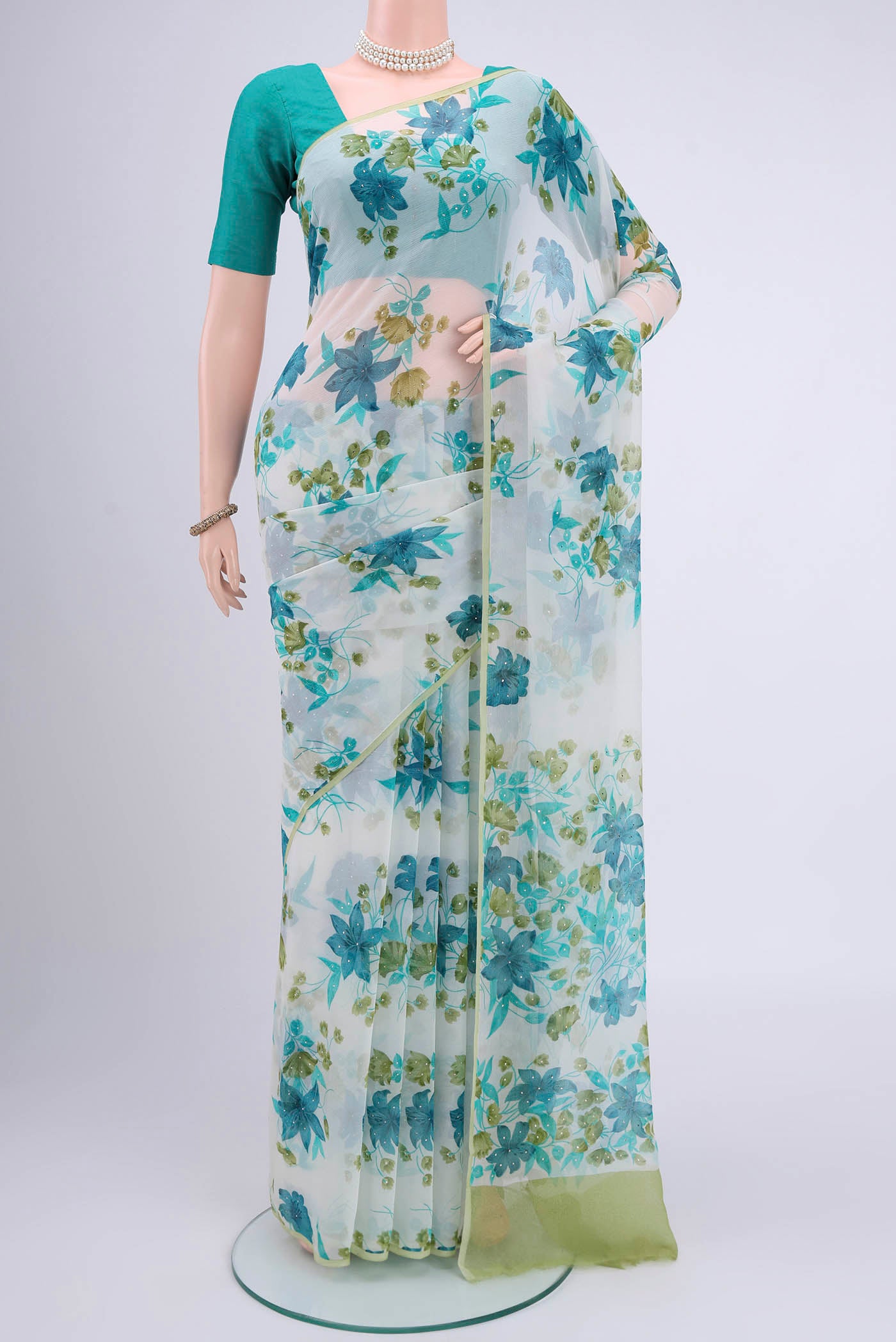White Mysore Chiffon Saree with Floral Print on the body and Without Border.  displayed on a mannequin