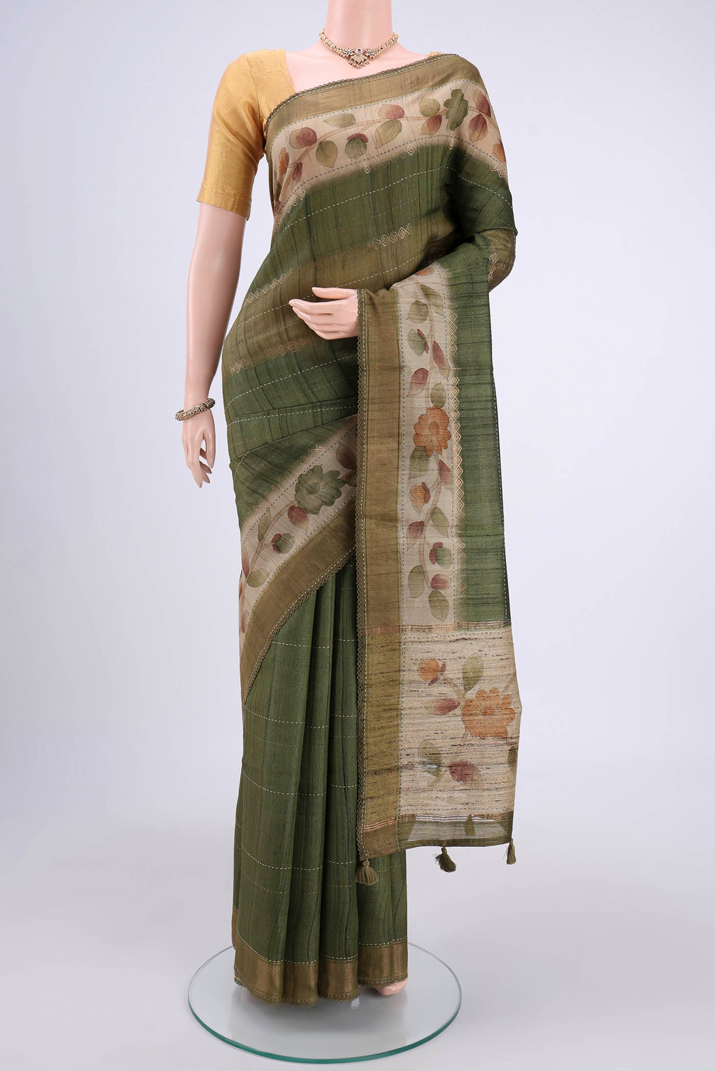 Multi Color Tussar Silk Saree with Printed design on the body and Fancy Border.  displayed on a mannequin