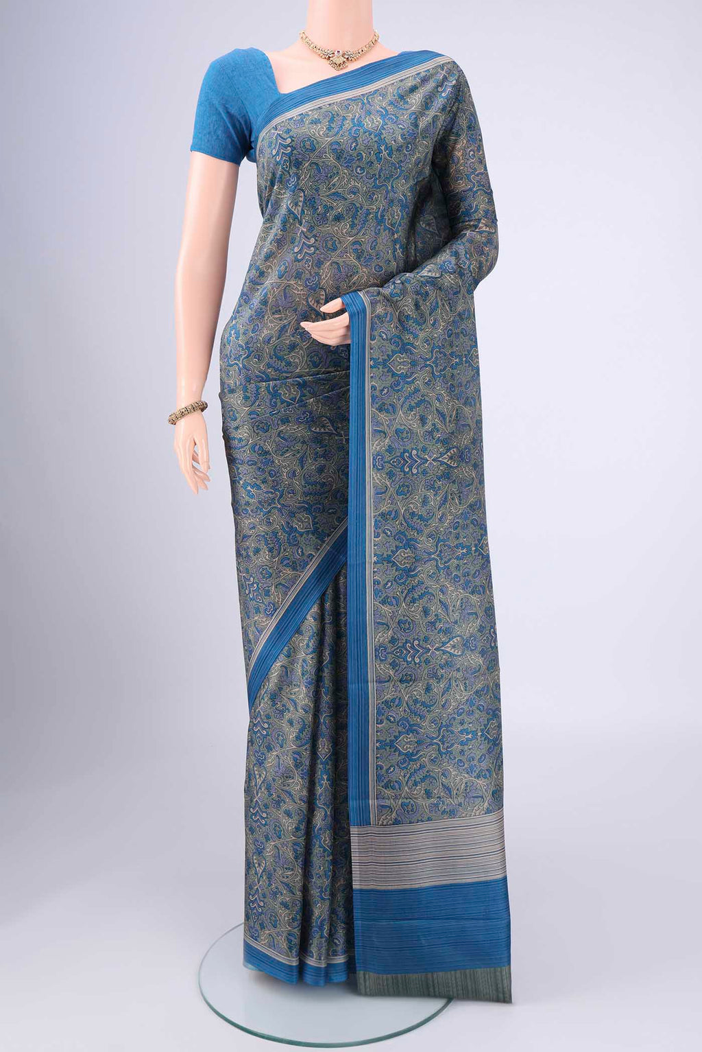 Davys Grey Printed Silk Saree with Floral Print on the body and Printed Border.  displayed on a mannequin