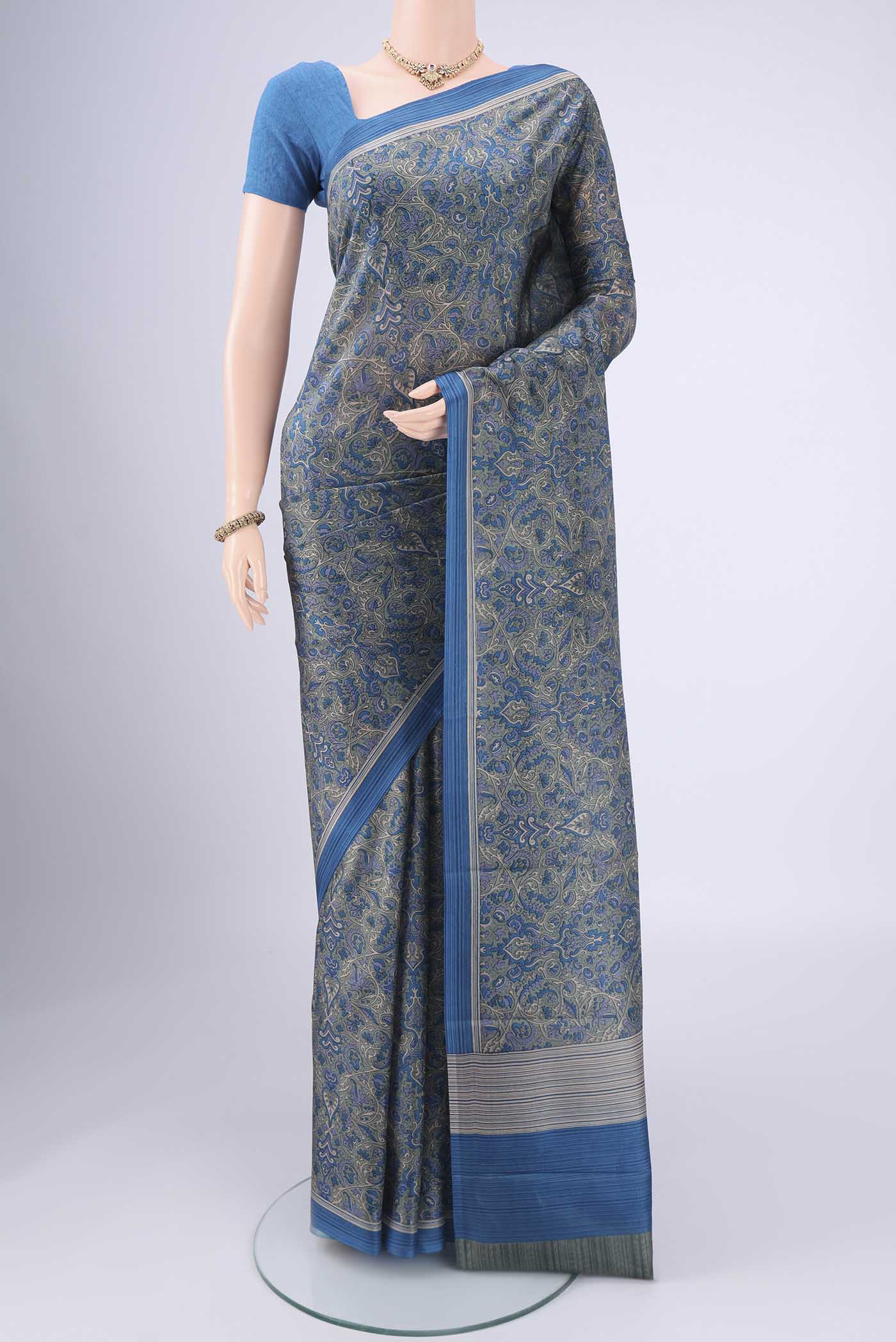 Davys Grey Printed Silk Saree with Floral Print on the body and Printed Border.  displayed on a mannequin